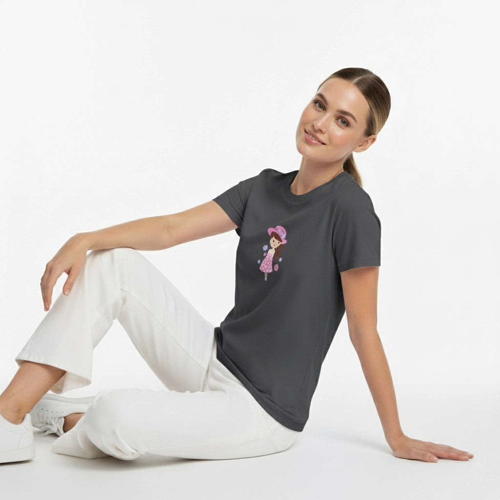 Woman wearing a dark gray t-shirt with a graphic design, sitting on a white background