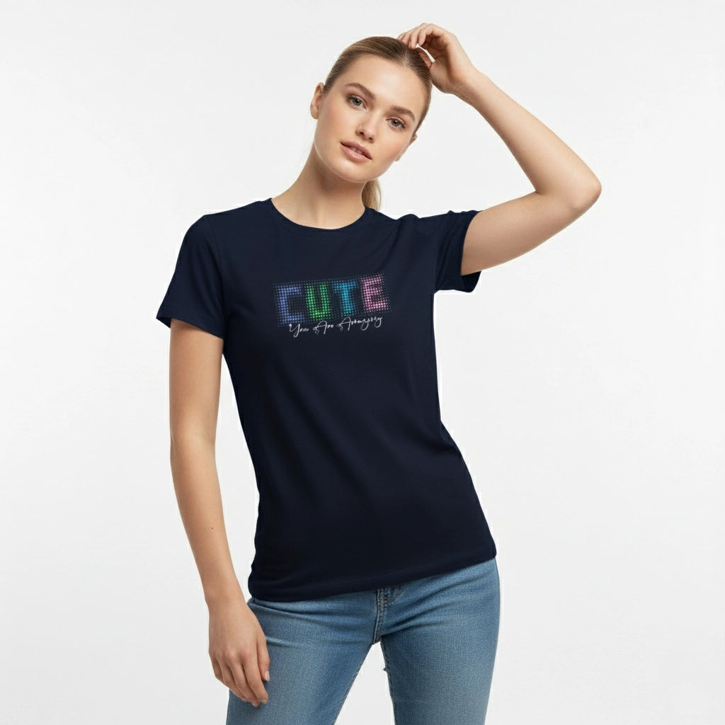 Woman wearing a black t-shirt with colorful 'CUTE' text on a white background