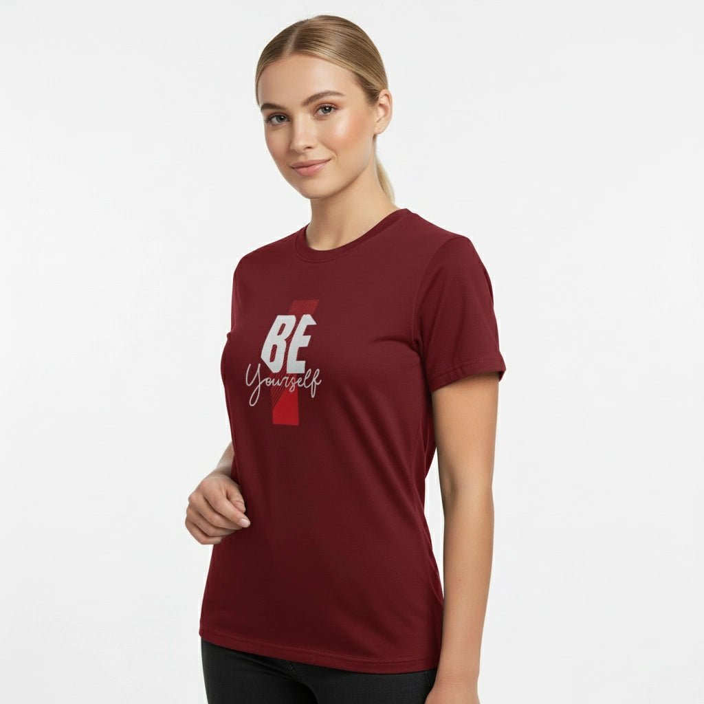 Woman wearing a maroon t-shirt with 'BE Yourself' text on a white background