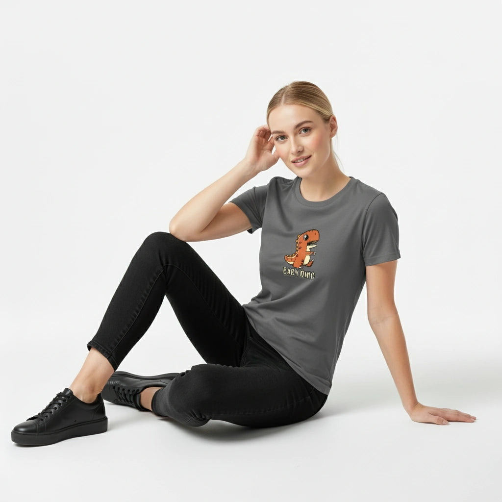 Woman wearing a gray t-shirt with a logo, sitting on a white background