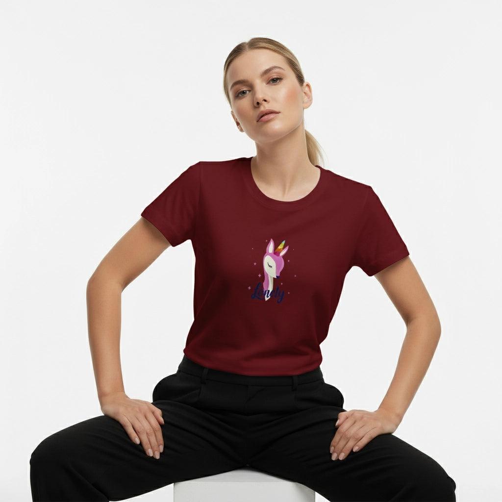 Woman wearing a maroon t-shirt with a unicorn graphic on a white background