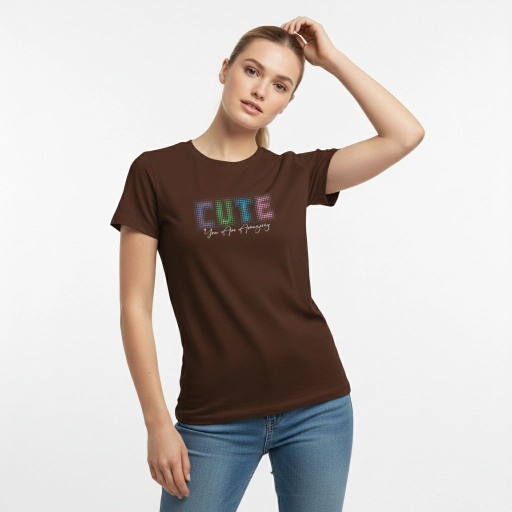 Woman wearing a brown t-shirt with 'CUTE' printed on it against a white background