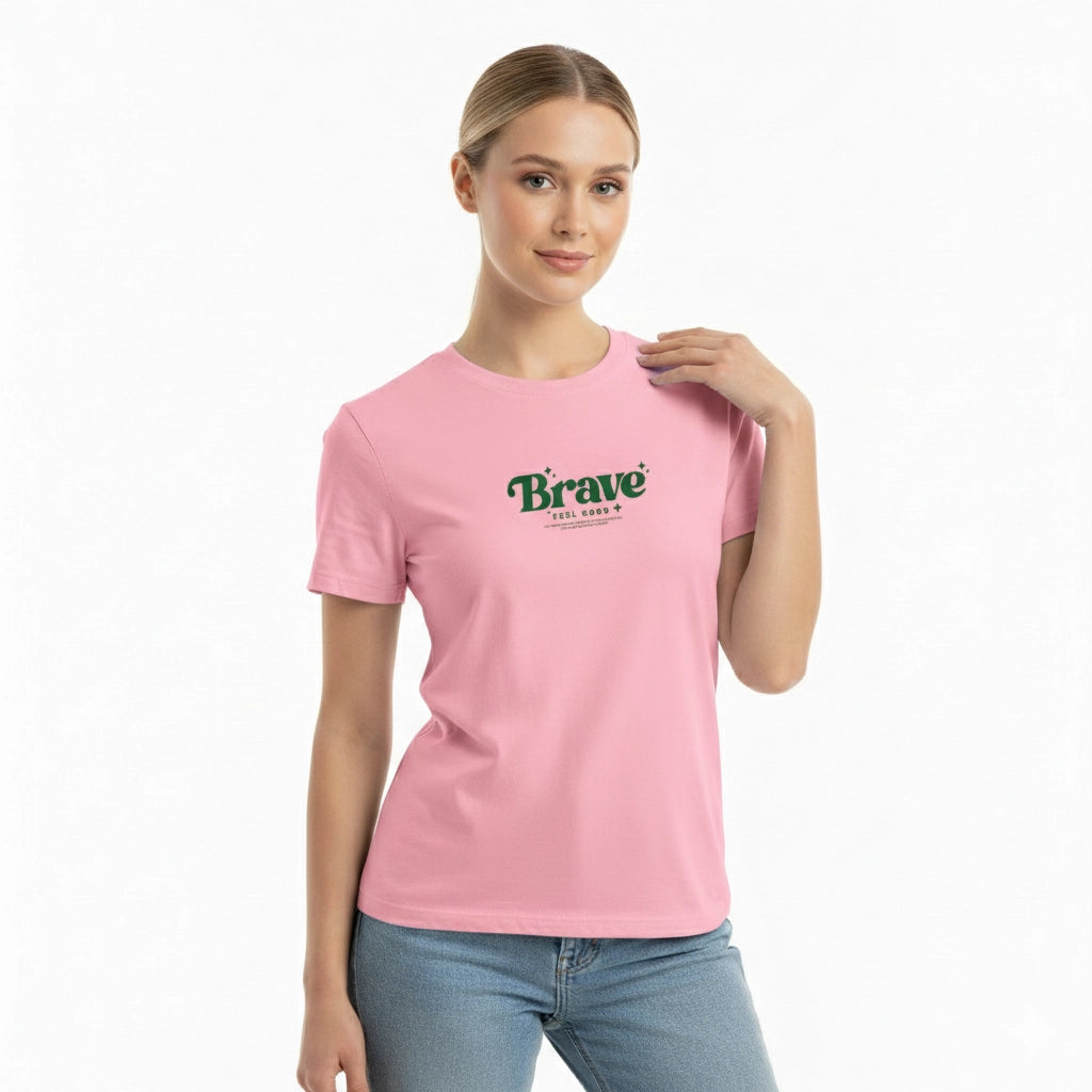 Woman wearing a pink t-shirt with 'Brave' printed on it against a white background
