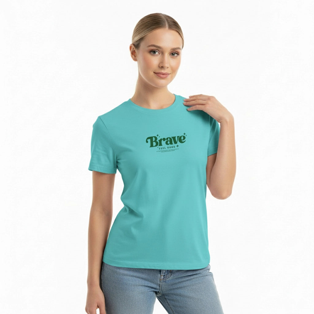 Woman wearing a turquoise t-shirt with 'Brave' printed on it against a white background