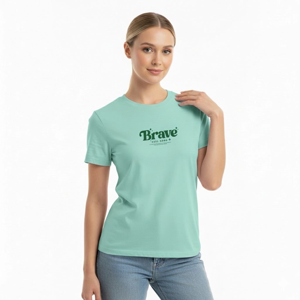 Woman wearing a light blue t-shirt with 'Brave' printed on it against a white background