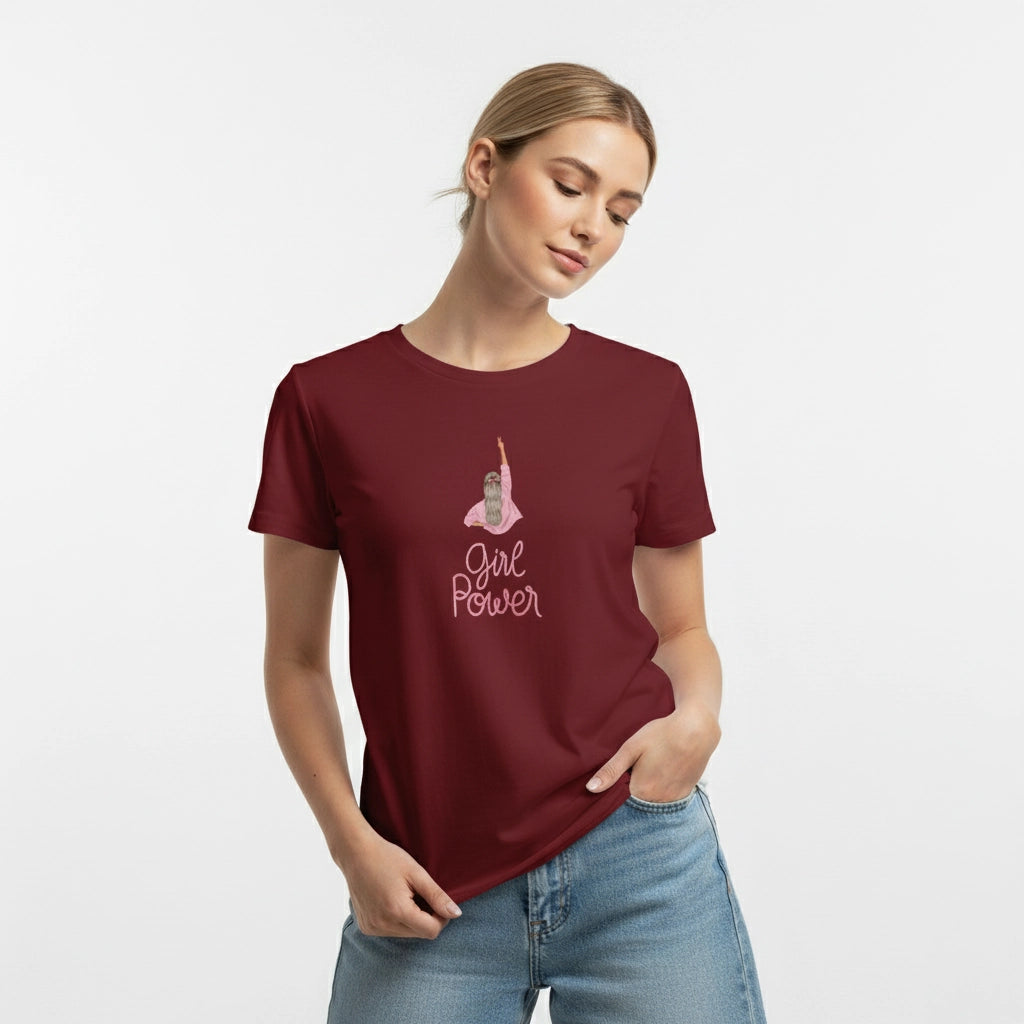 Woman wearing a maroon t-shirt with 'Girl Power' text and graphic on a light gray background