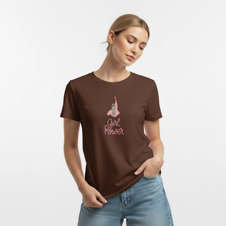 Woman wearing a brown t-shirt with 'Girl Power' text and graphic on a white background