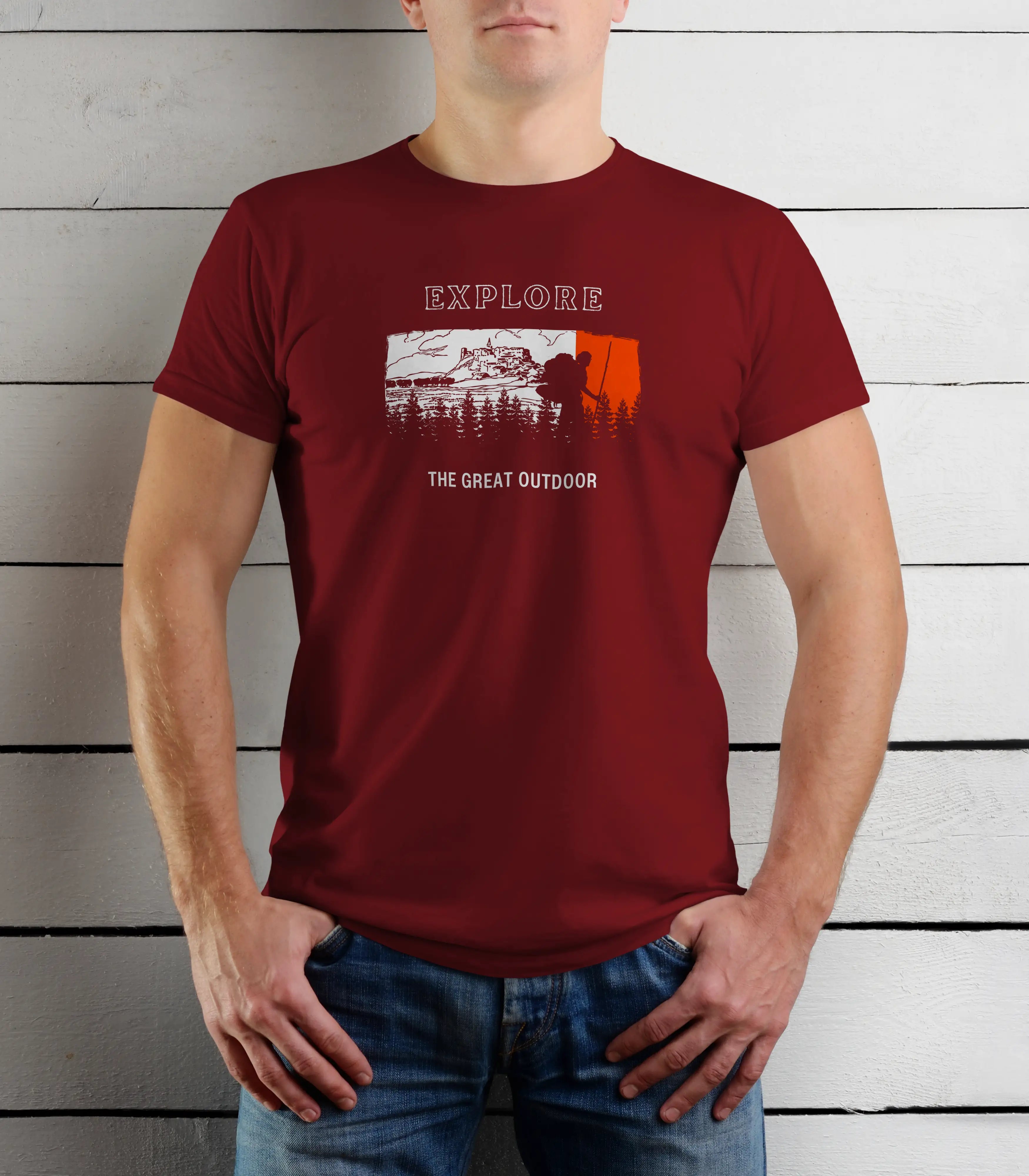 Person wearing a red t-shirt with outdoor graphic and text against a wooden background