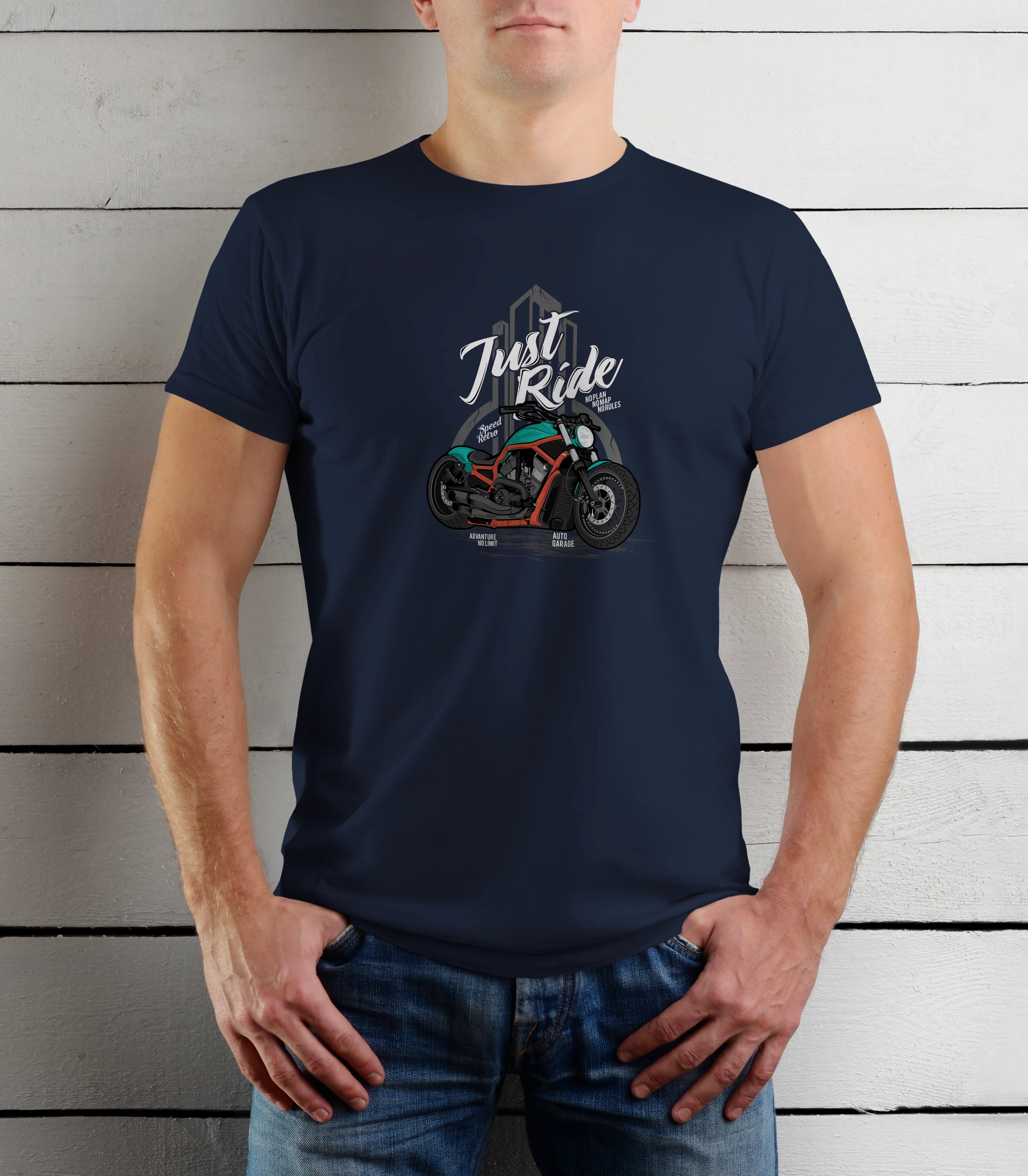 Person wearing a navy blue t-shirt with a graphic design and text against a wooden background