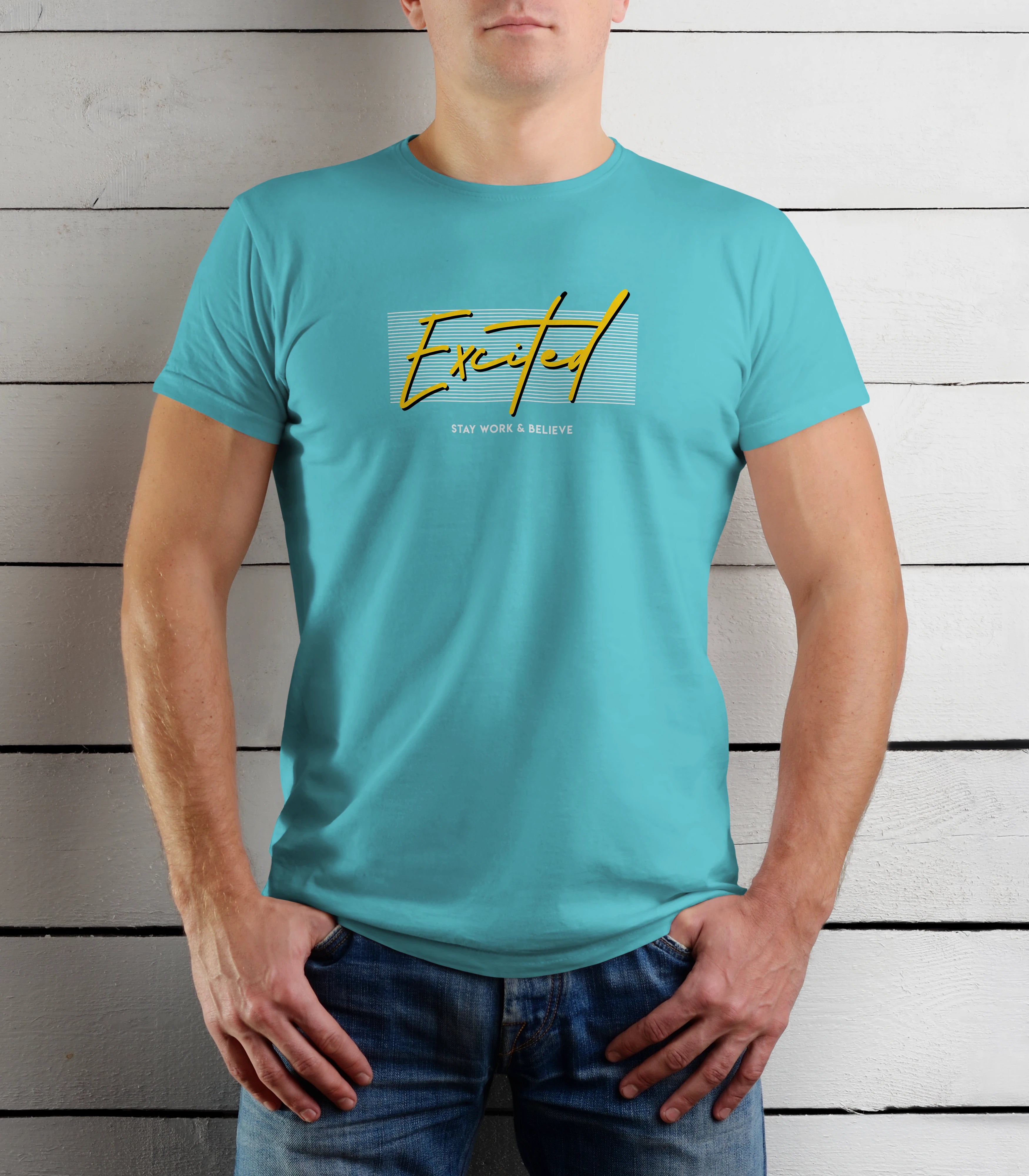 Person wearing a turquoise t-shirt with yellow text against a wooden background