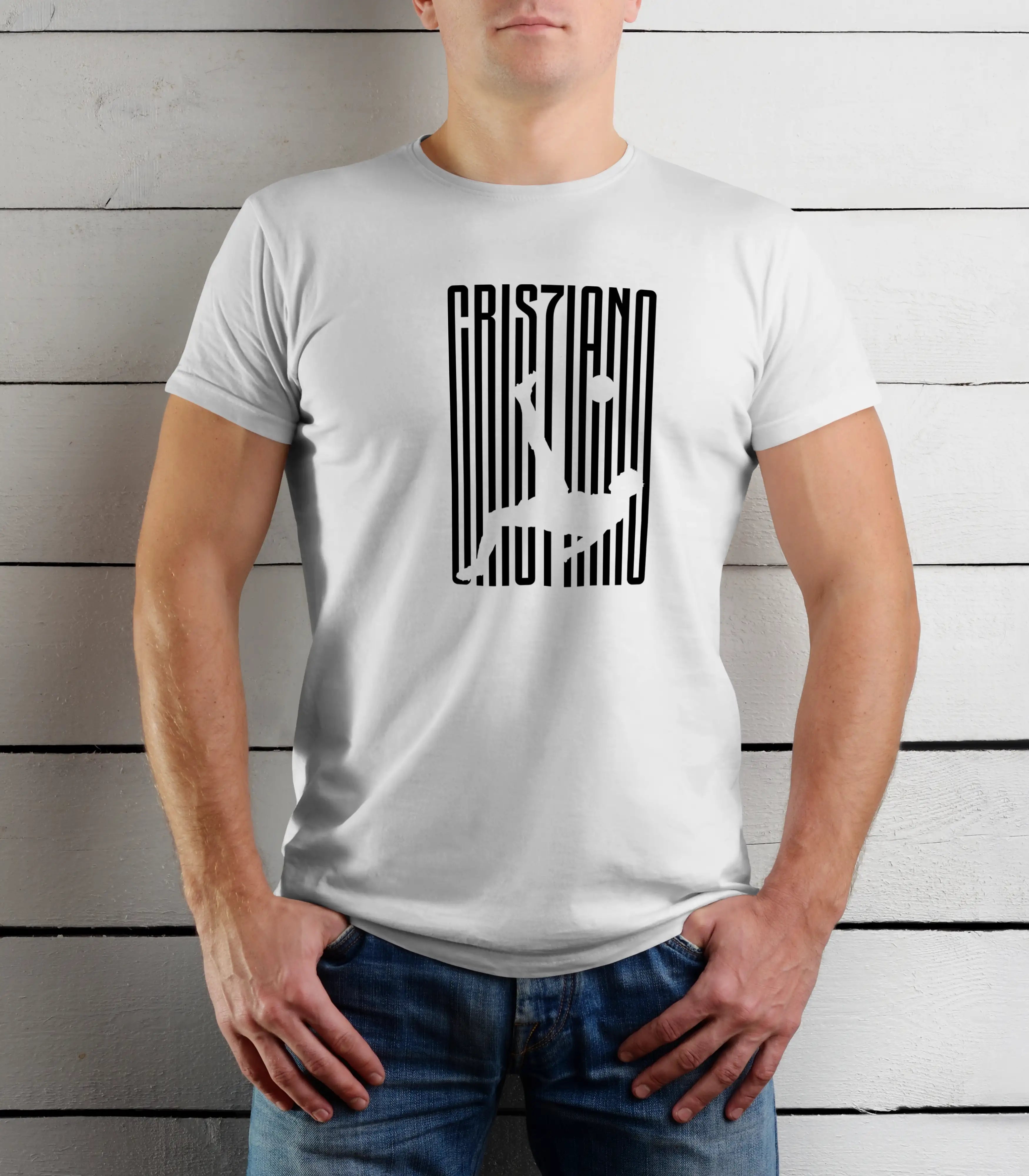 Person wearing a white t-shirt with black graphic design against a wooden background