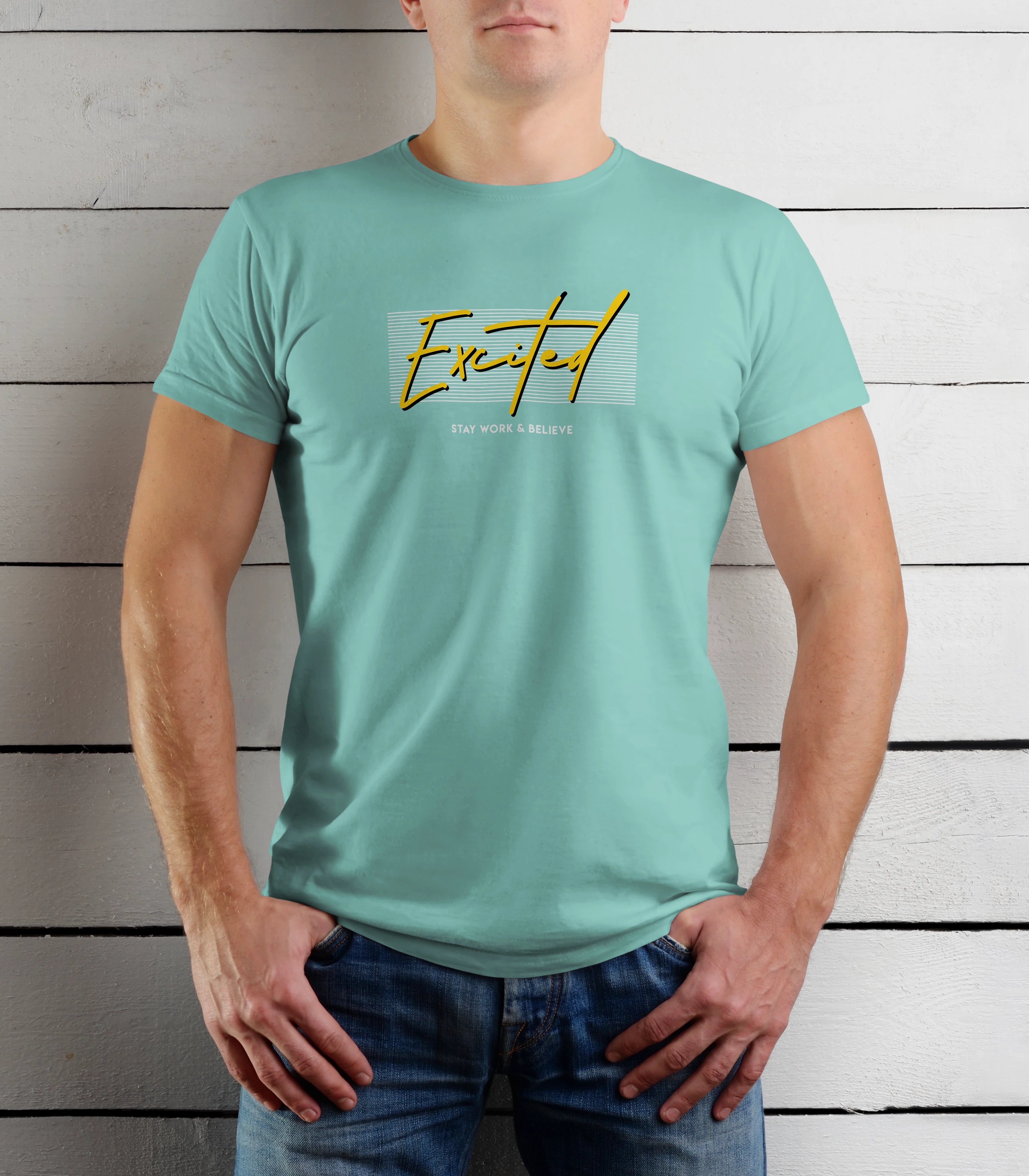 Person wearing a light blue t-shirt with yellow text against a wooden background