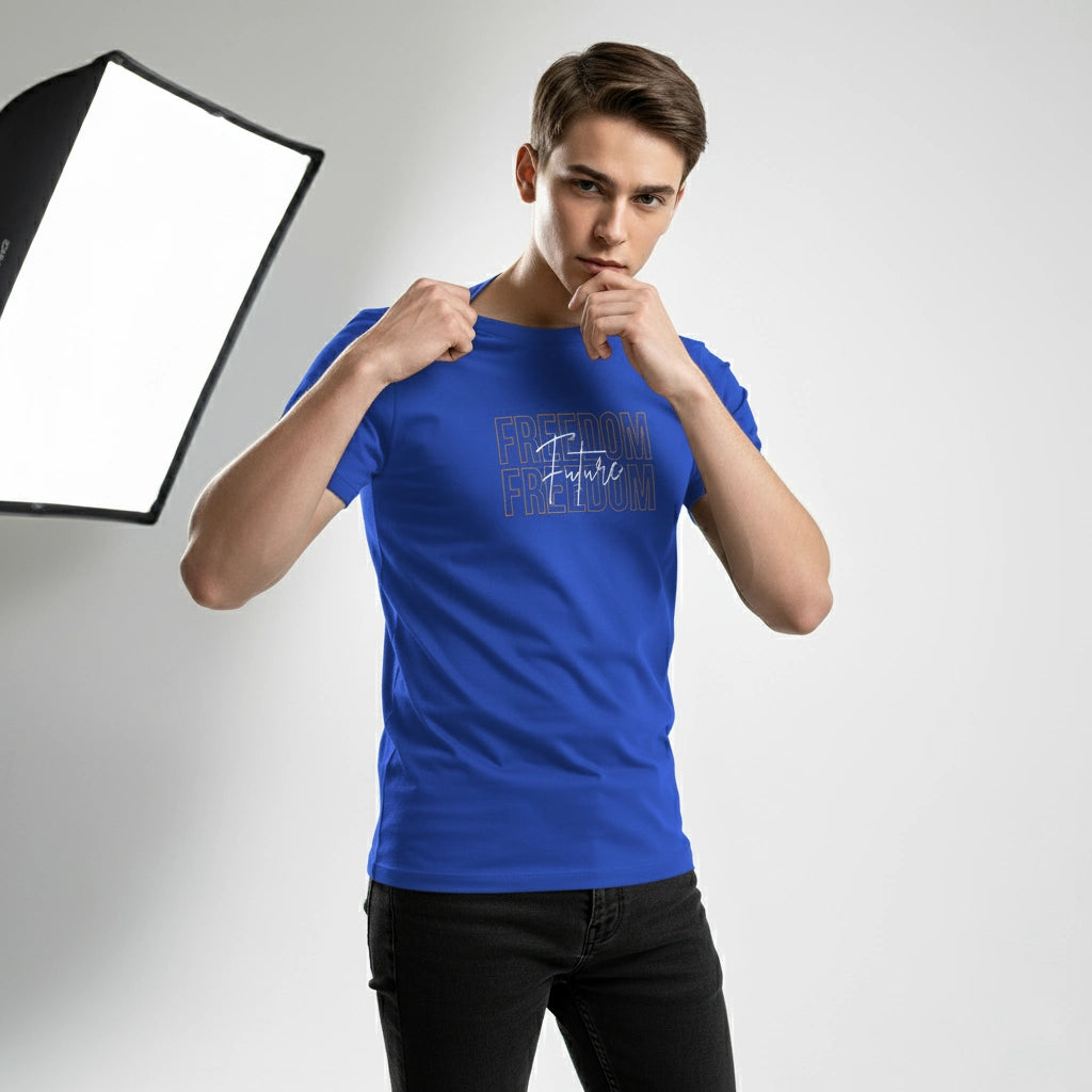 Person wearing a blue t-shirt with text, standing in front of a softbox light.