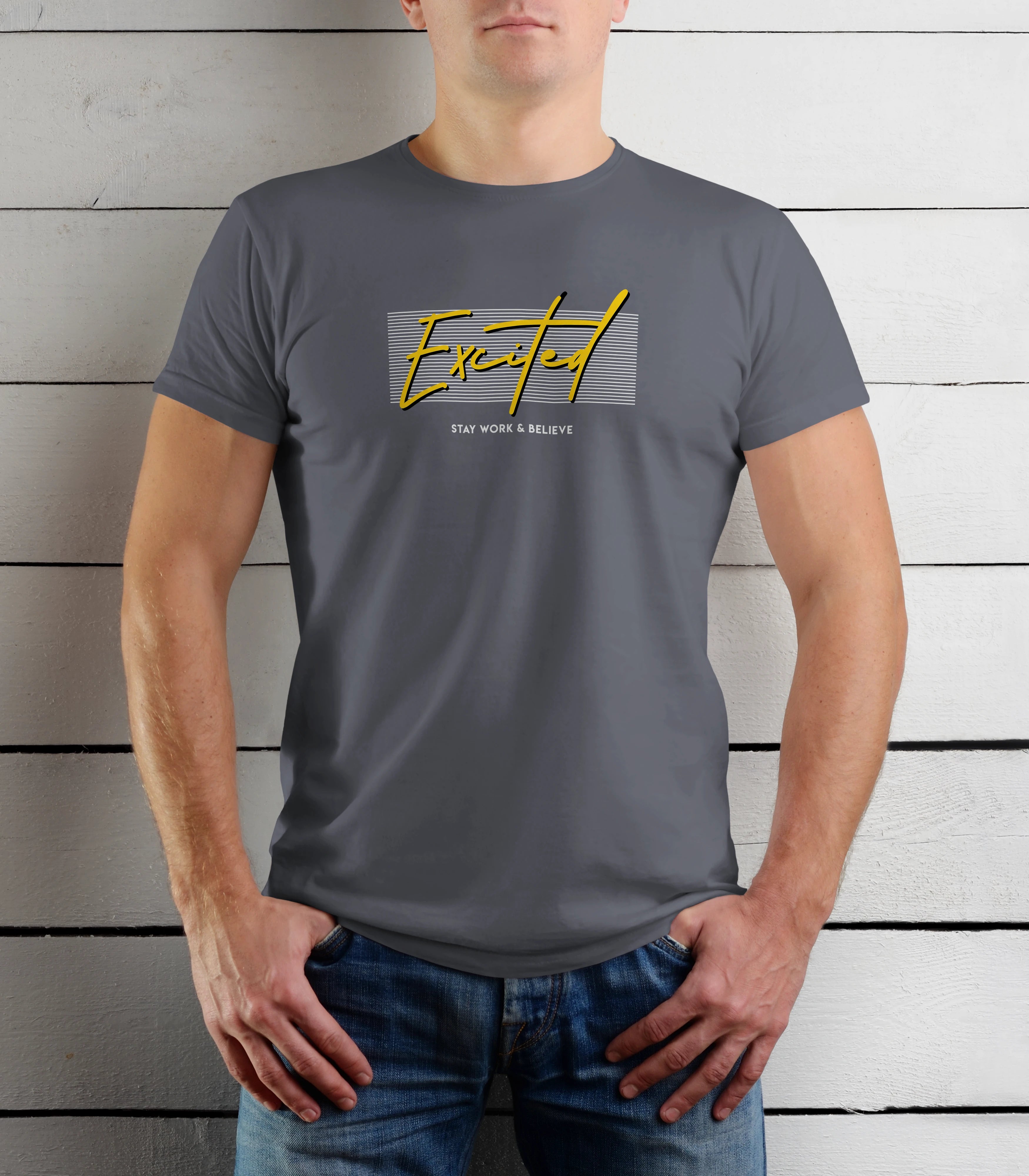 Person wearing a gray t-shirt with yellow text against a wooden background