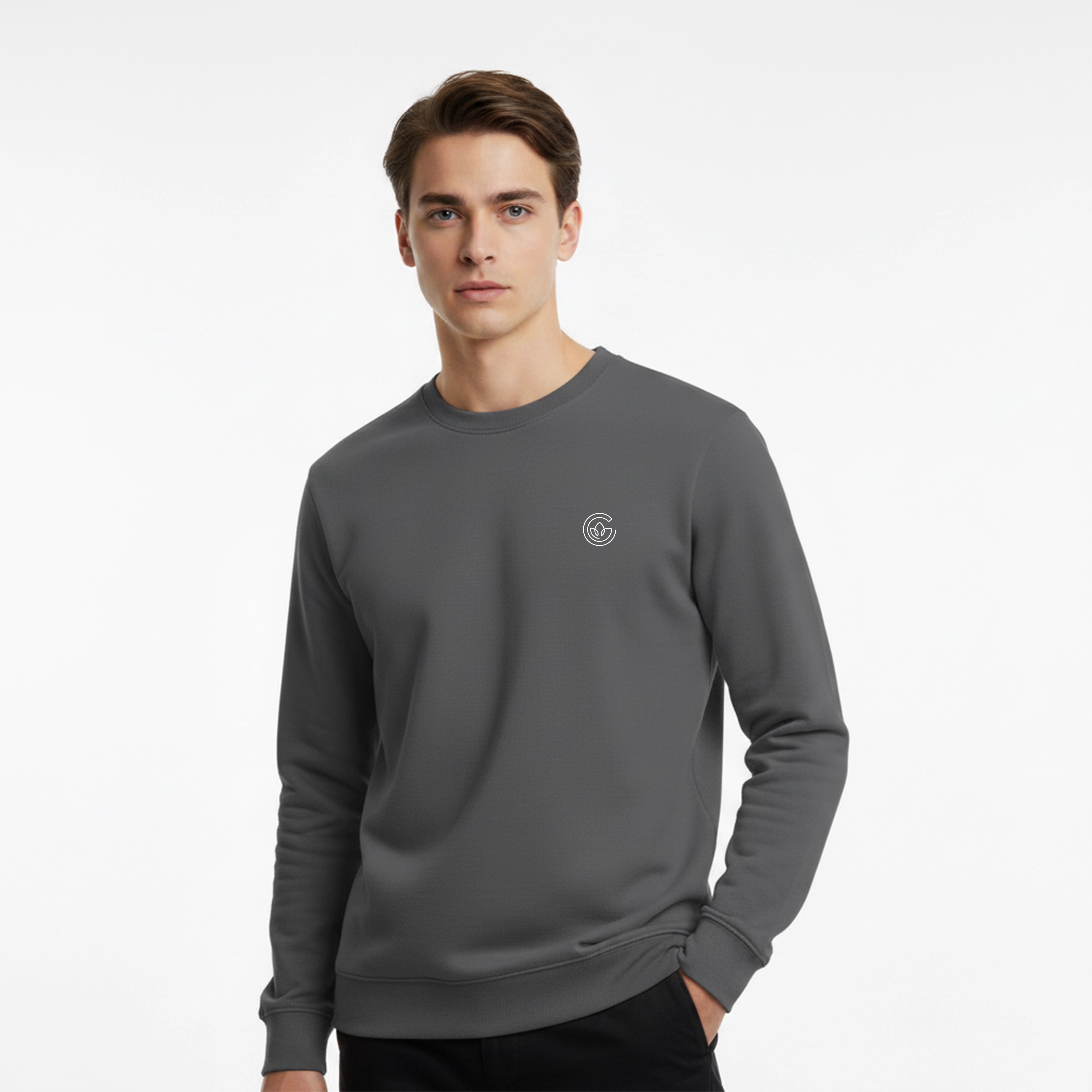 Man wearing a gray sweatshirt with a small logo on a white background