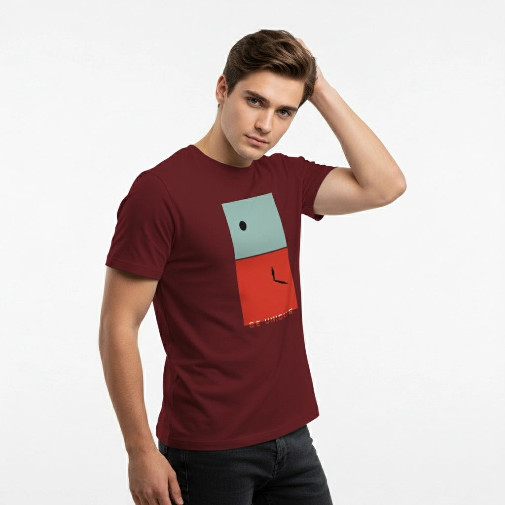 Man wearing a maroon t-shirt with a colorful geometric design on a white background