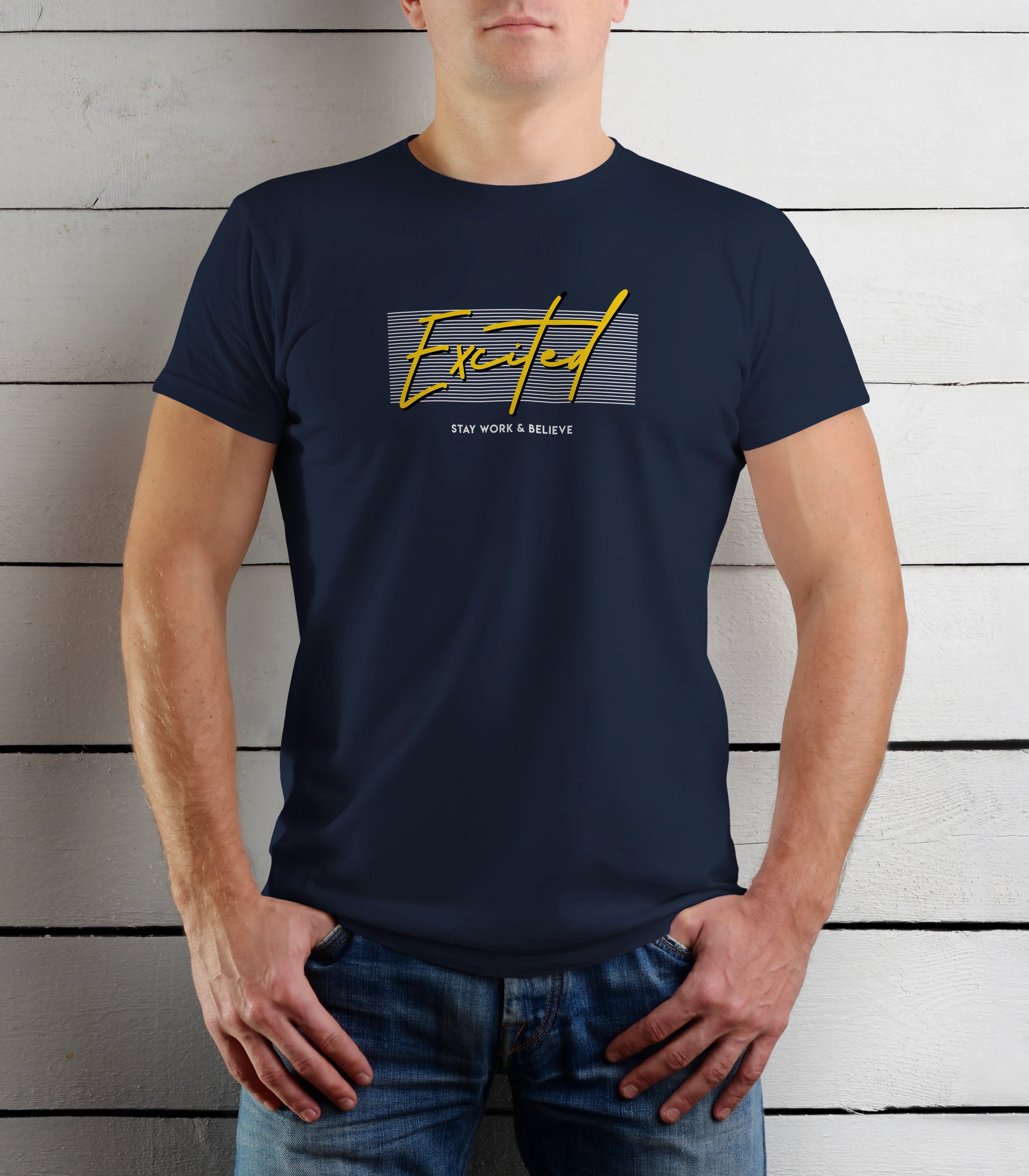 Person wearing a navy blue t-shirt with yellow text against a wooden background