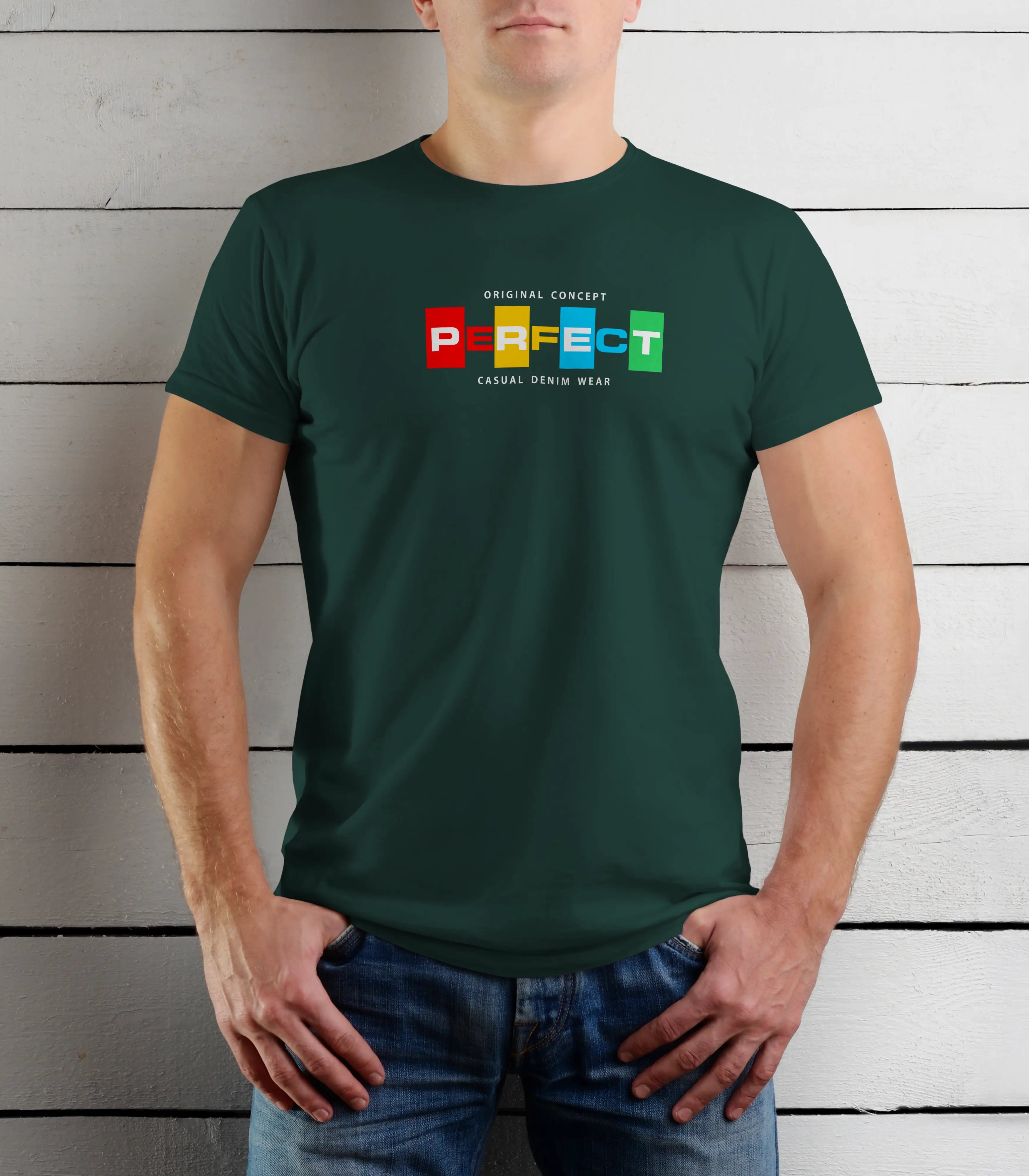 Person wearing a green t-shirt with colorful text design against a wooden background
