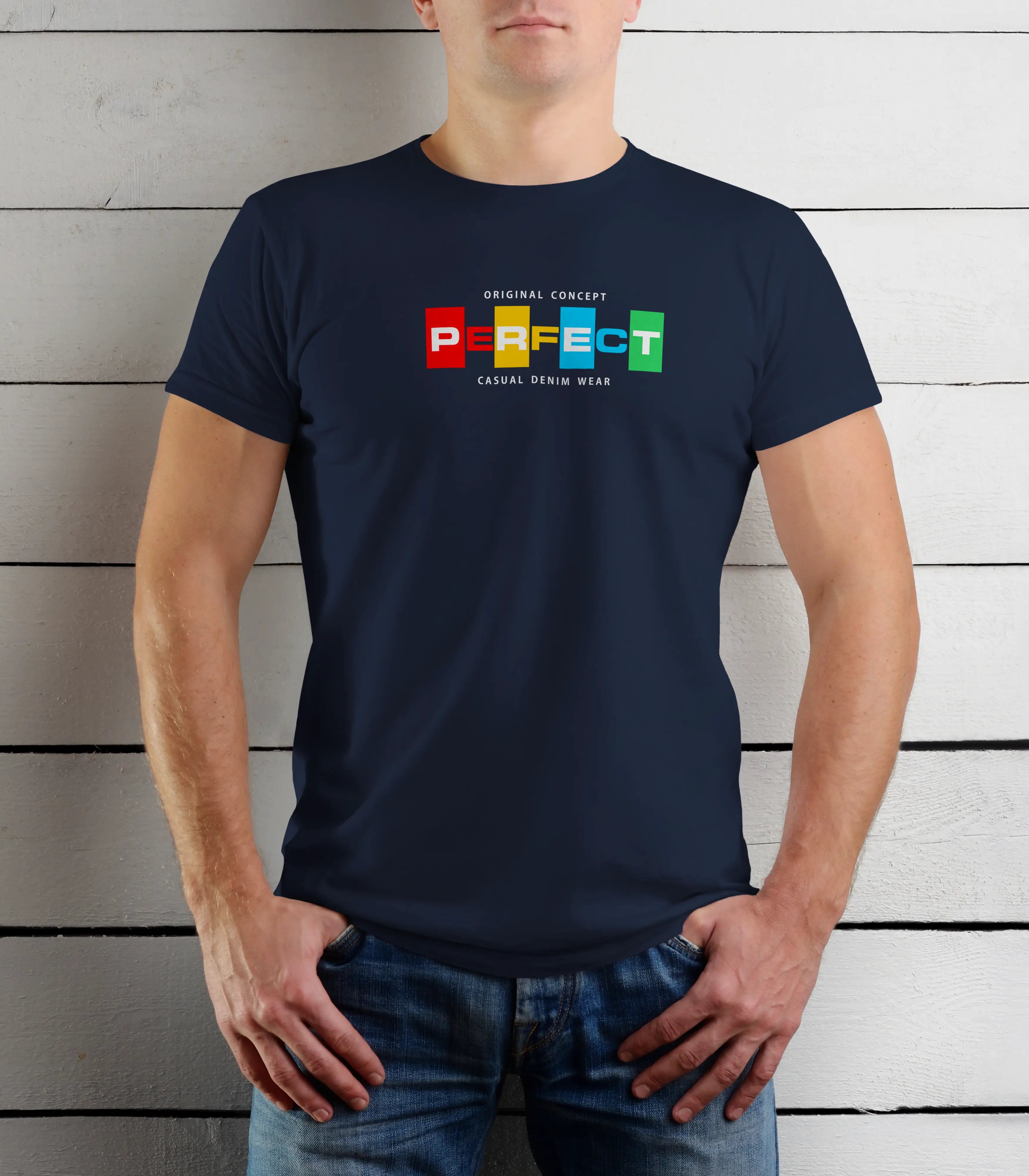 Person wearing a navy blue t-shirt with colorful text design against a wooden background