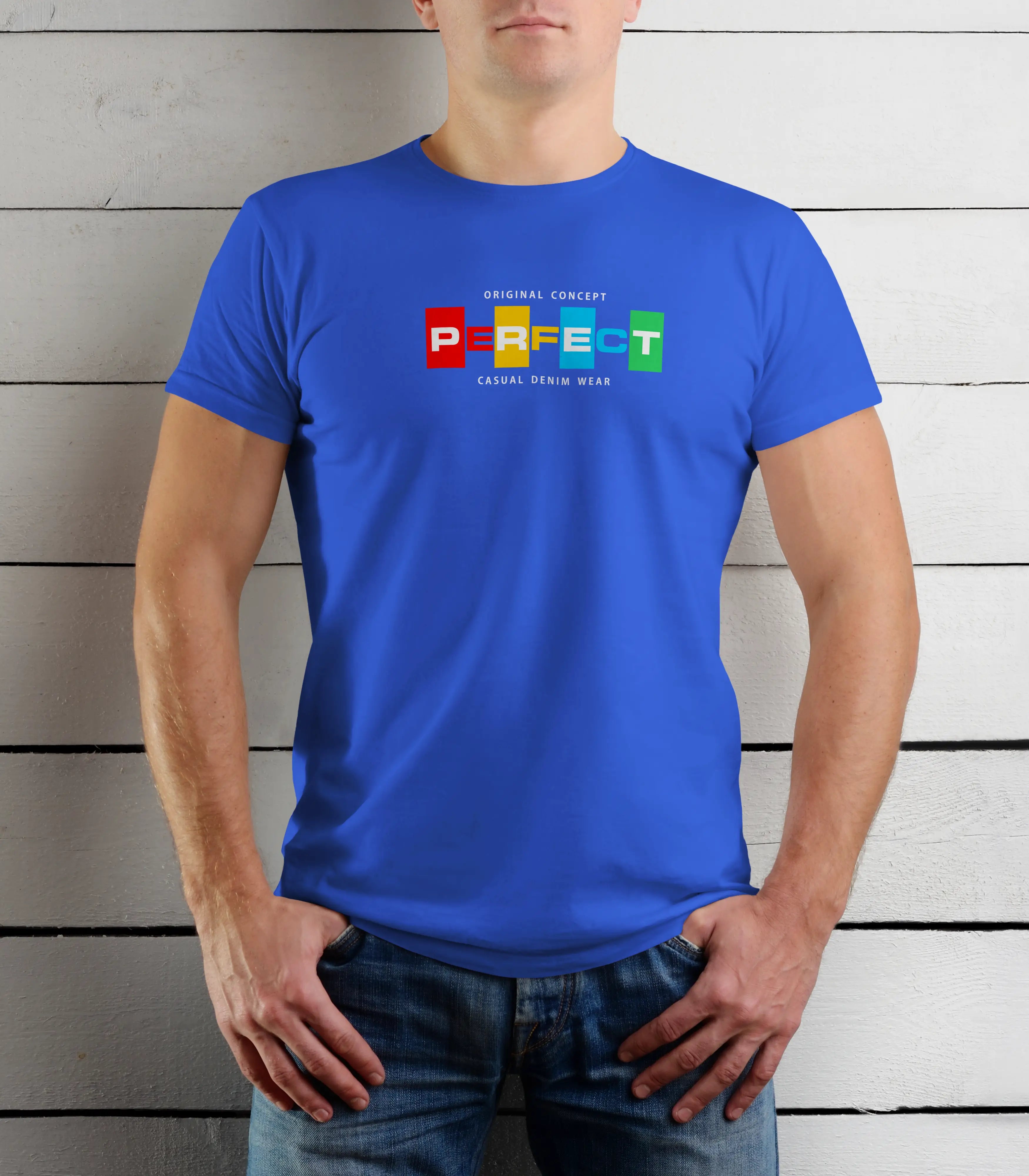 Person wearing a blue t-shirt with colorful text design against a wooden background