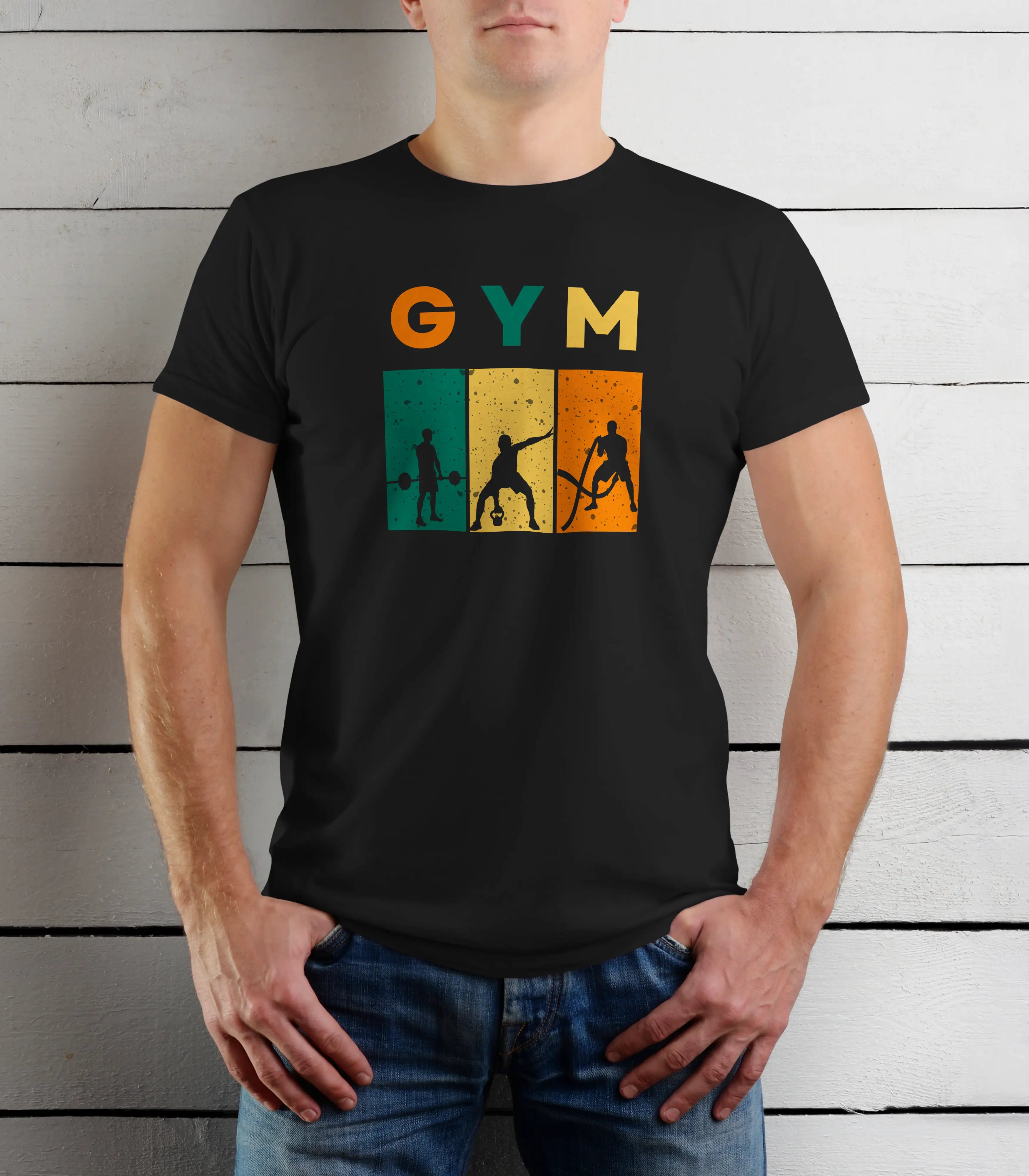 Person wearing a black t-shirt with 'GYM' and gym-themed graphics against a wooden background