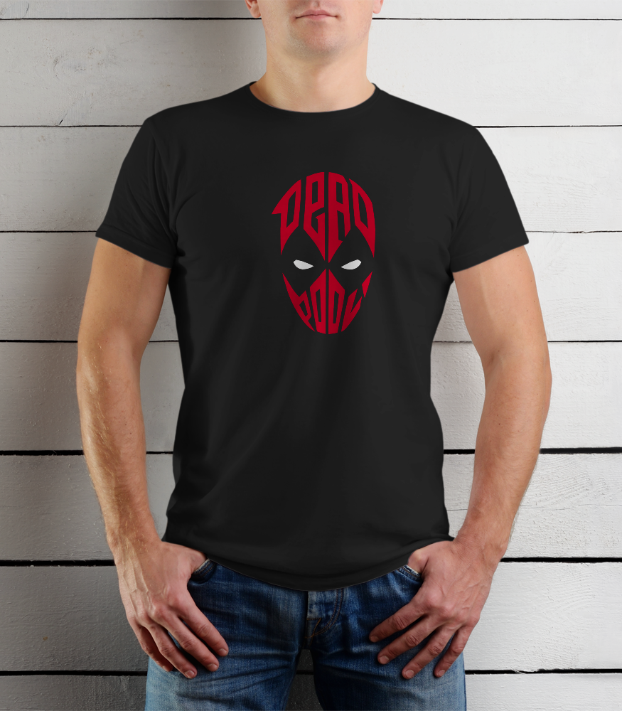 Person wearing a black t-shirt with a red graphic design against a wooden background