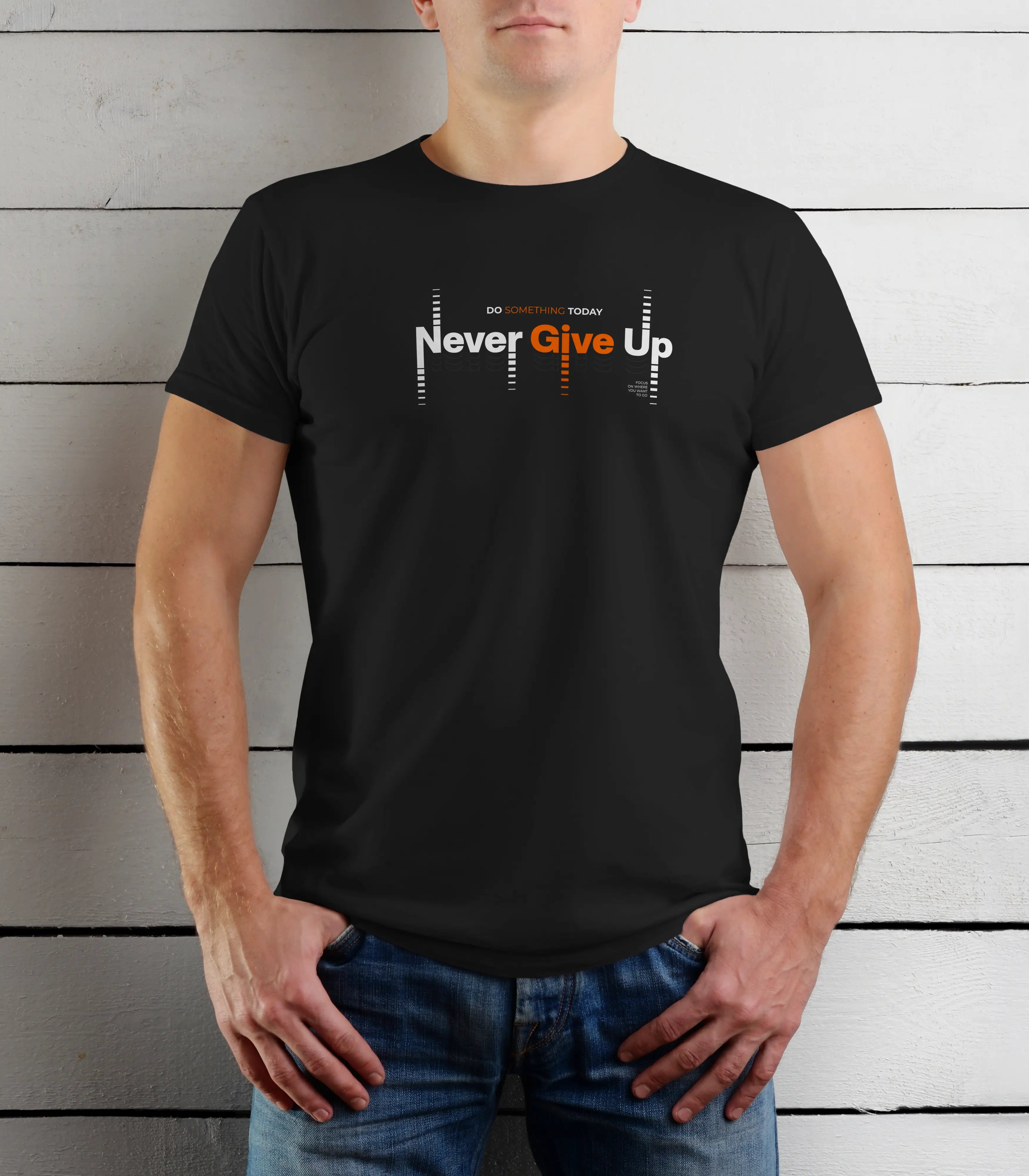 Person wearing a black t-shirt with 'Never Give Up' text against a wooden background