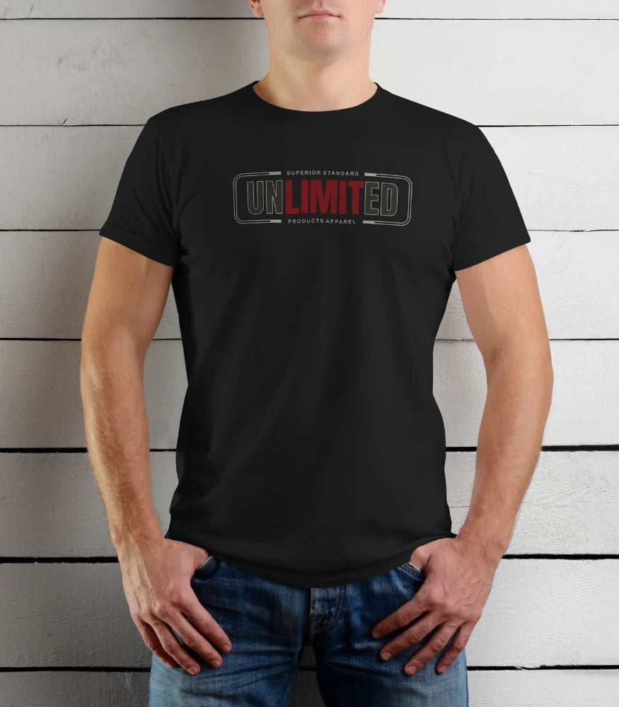 Person wearing a black t-shirt with 'UNLIMITED' logo against a wooden background