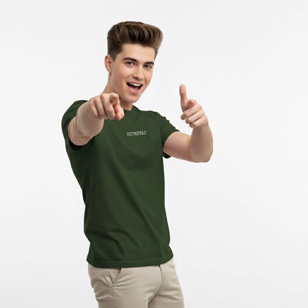 Person wearing a green t-shirt with text, pointing forward on a white background