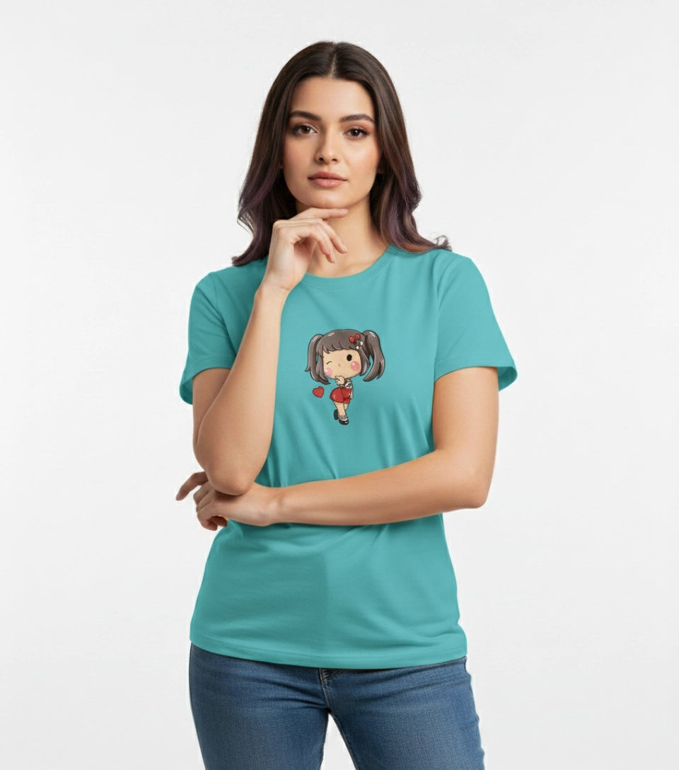 Woman wearing a teal t-shirt with a character design on a white background
