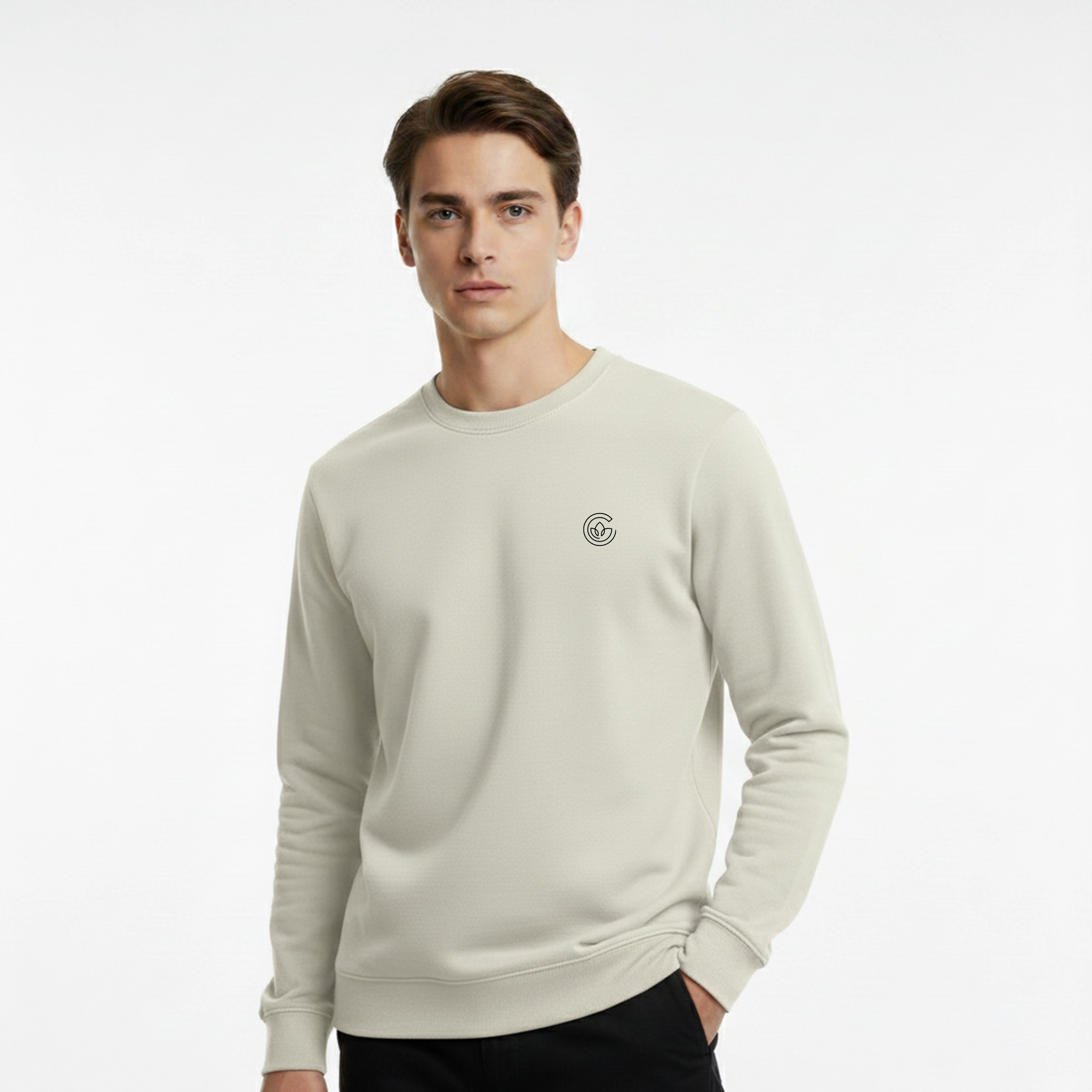 Man wearing a light gray sweatshirt with a logo on a white background
