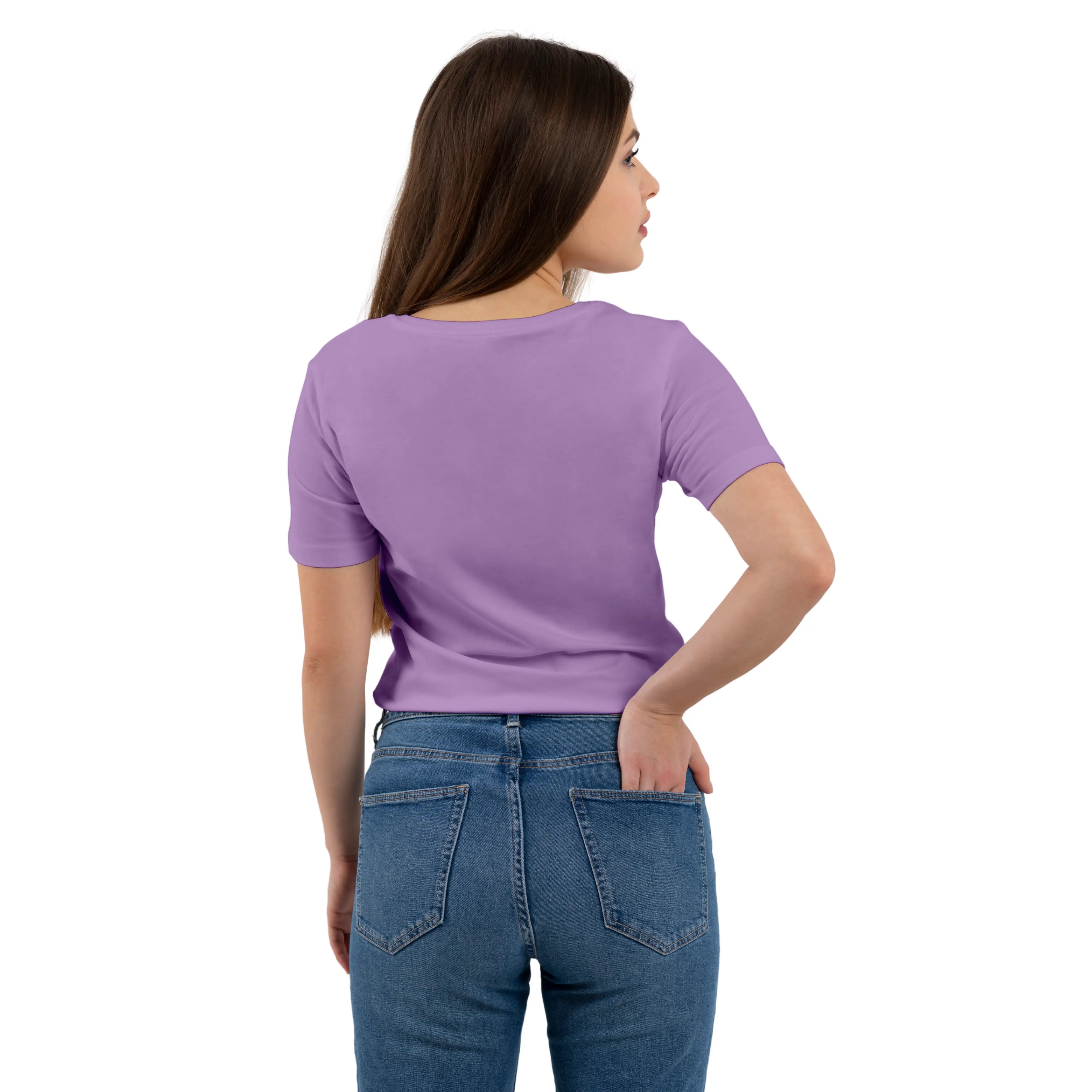 Woman wearing a purple t-shirt and blue jeans on a white background
