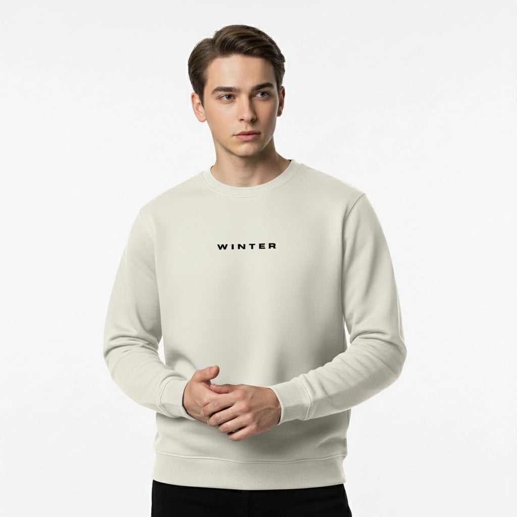 Man wearing a beige sweater with 'WINTER' text on a white background