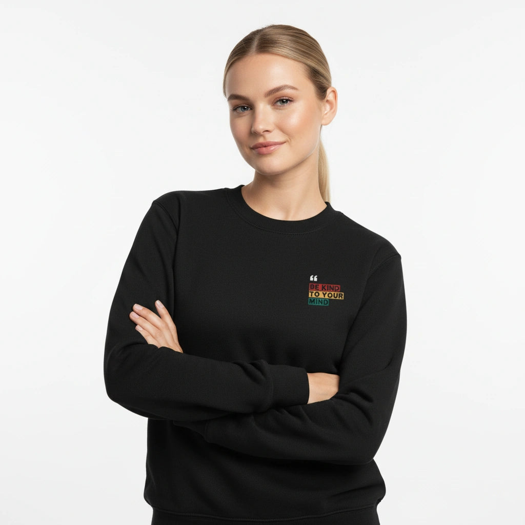 Woman wearing a black sweatshirt with a logo on a white background