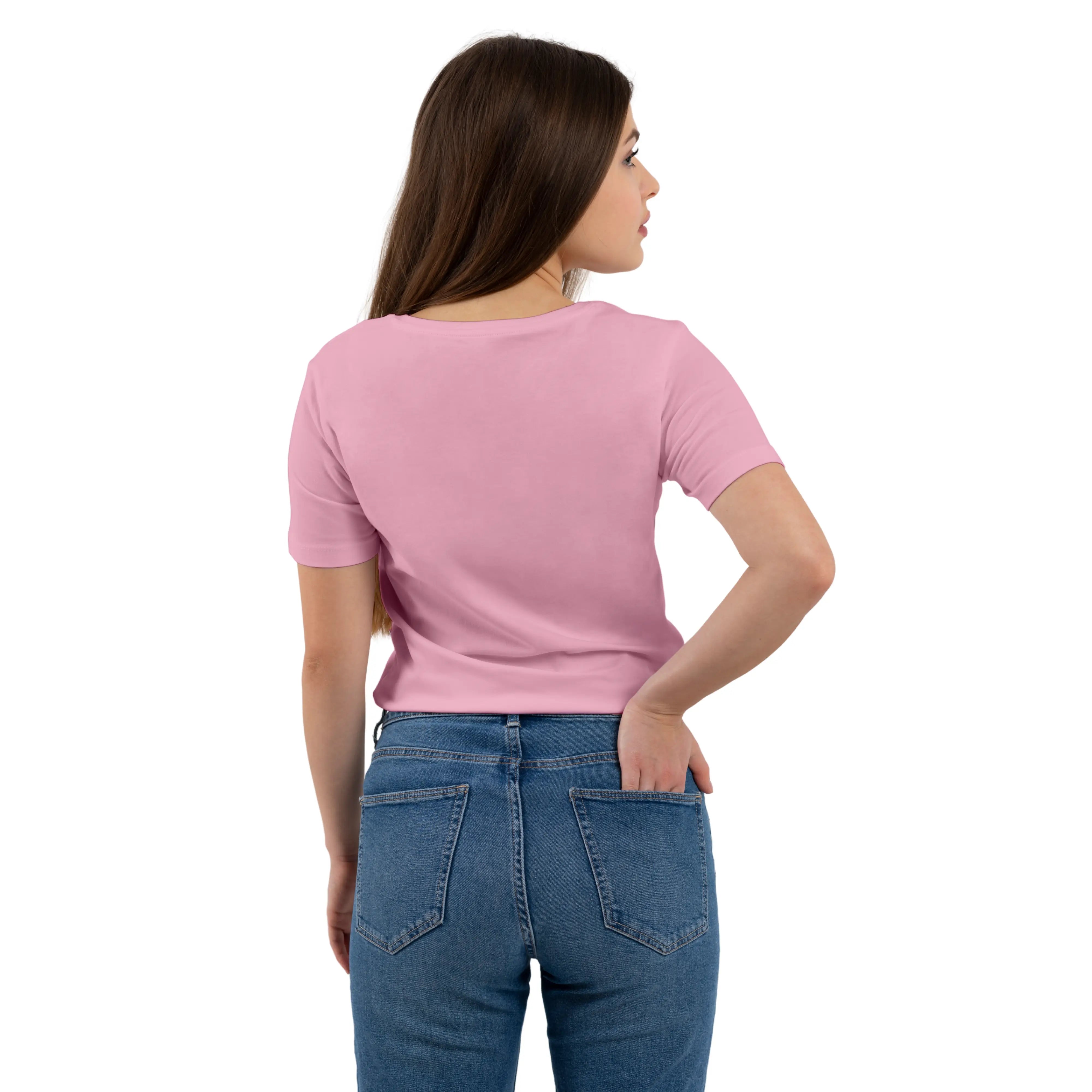 Woman wearing a pink t-shirt and blue jeans on a white background