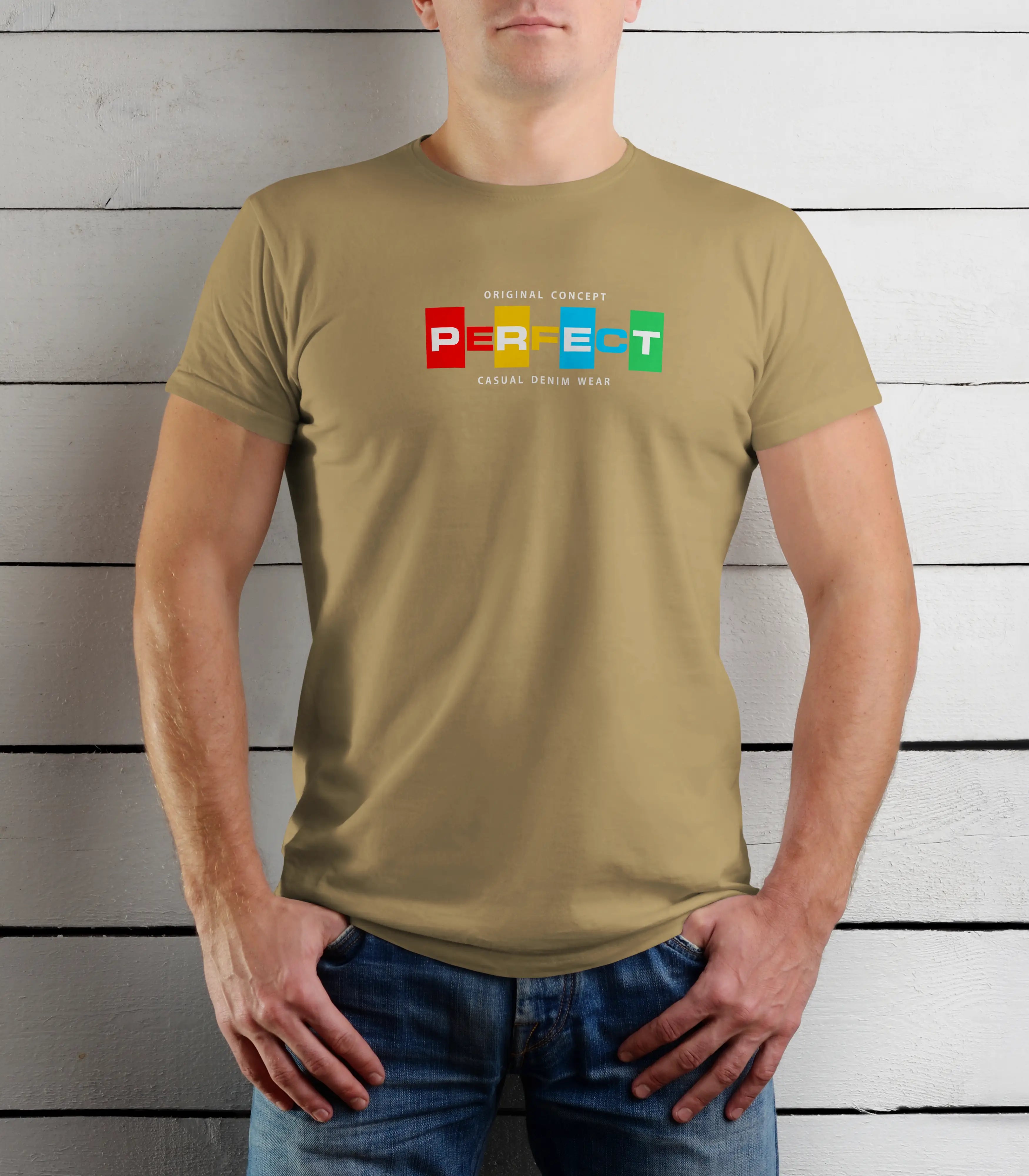 Person wearing a khaki t-shirt with colorful text design against a wooden background