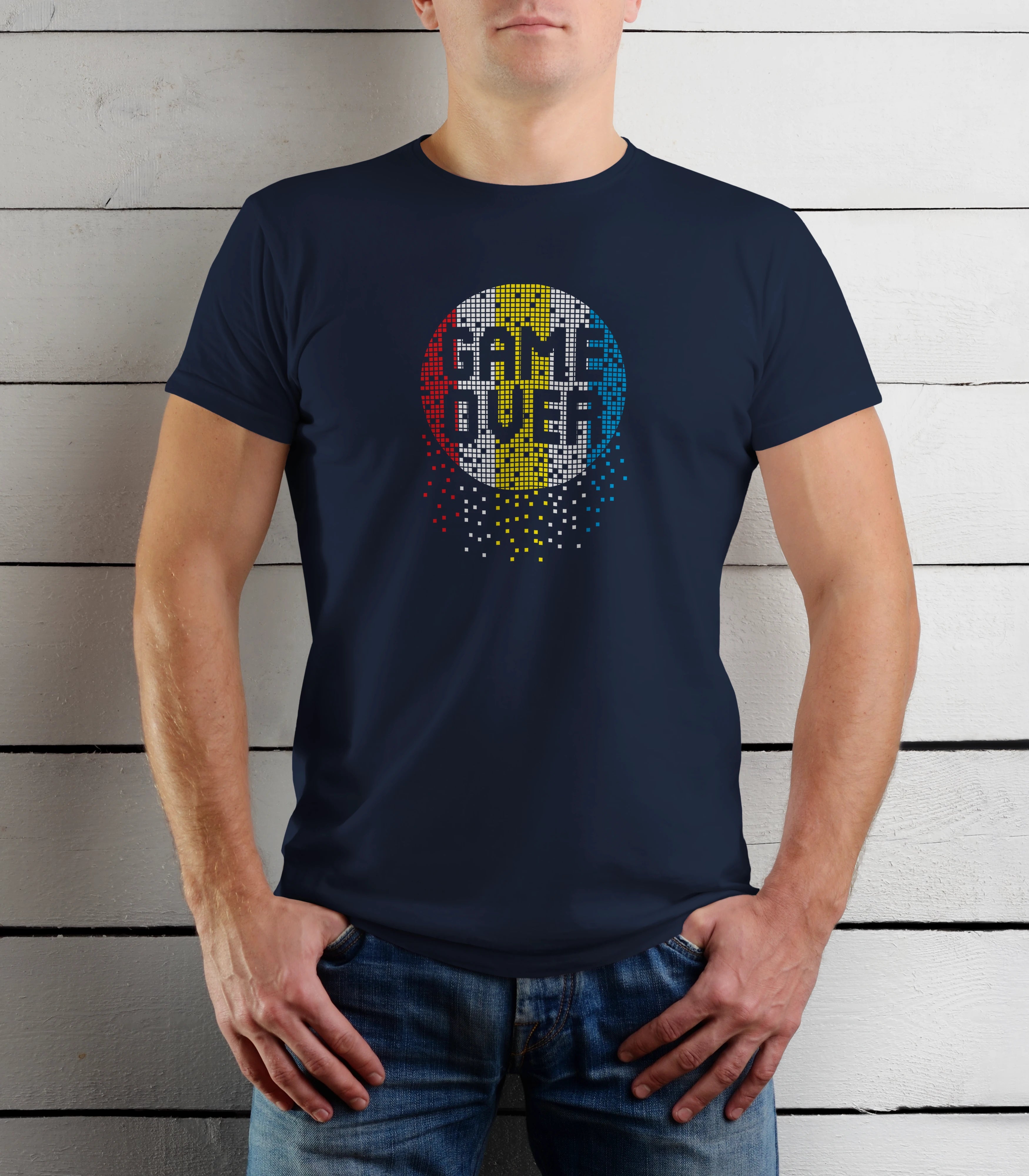 Person wearing a navy blue t-shirt with 'Game Over' design against a wooden background
