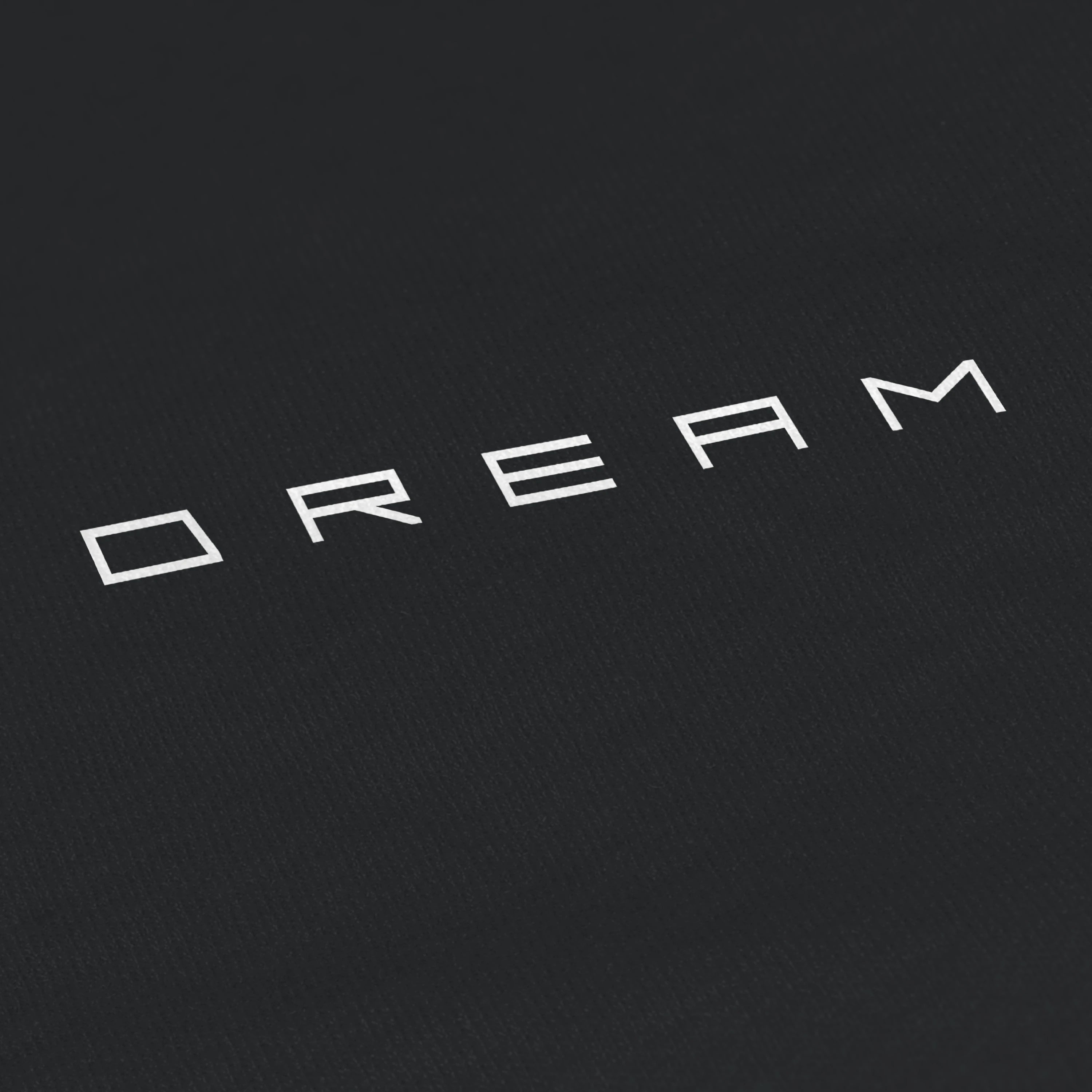 Black background with white 'DREAM' text