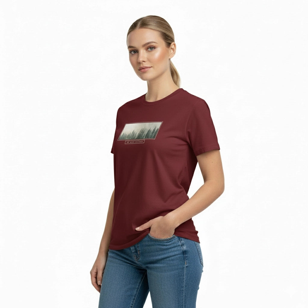 Woman wearing a maroon t-shirt with a graphic design on a white background