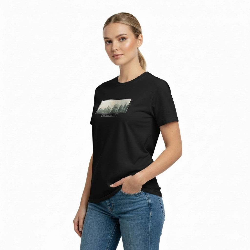 Woman wearing a black t-shirt with a graphic design on a white background