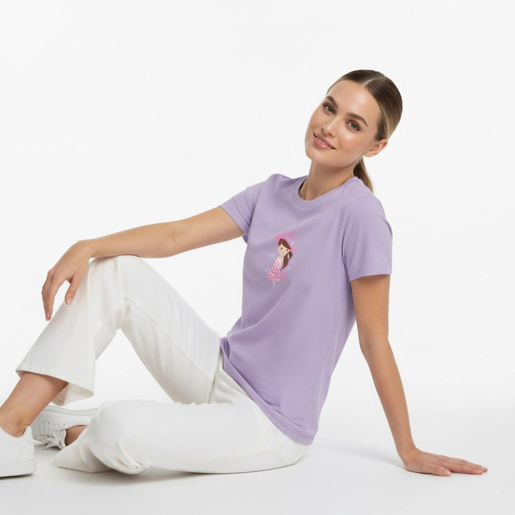 Woman wearing a purple t-shirt with a graphic design sitting on a white background