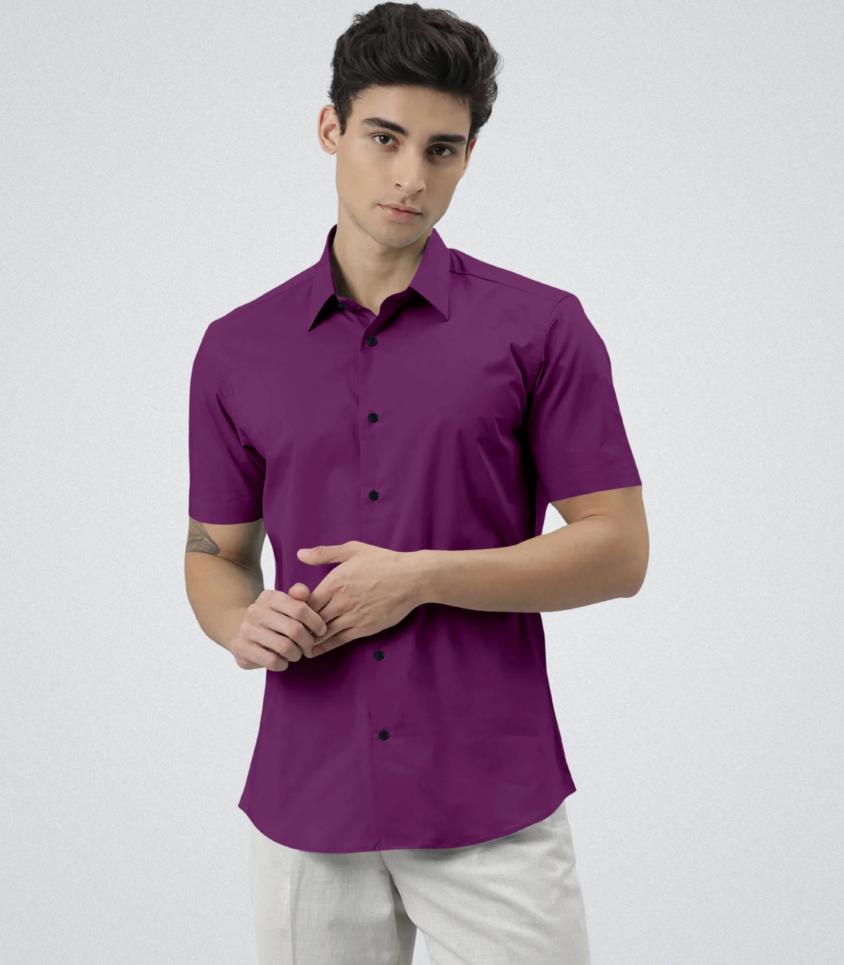 Man wearing a purple shirt on a white background
