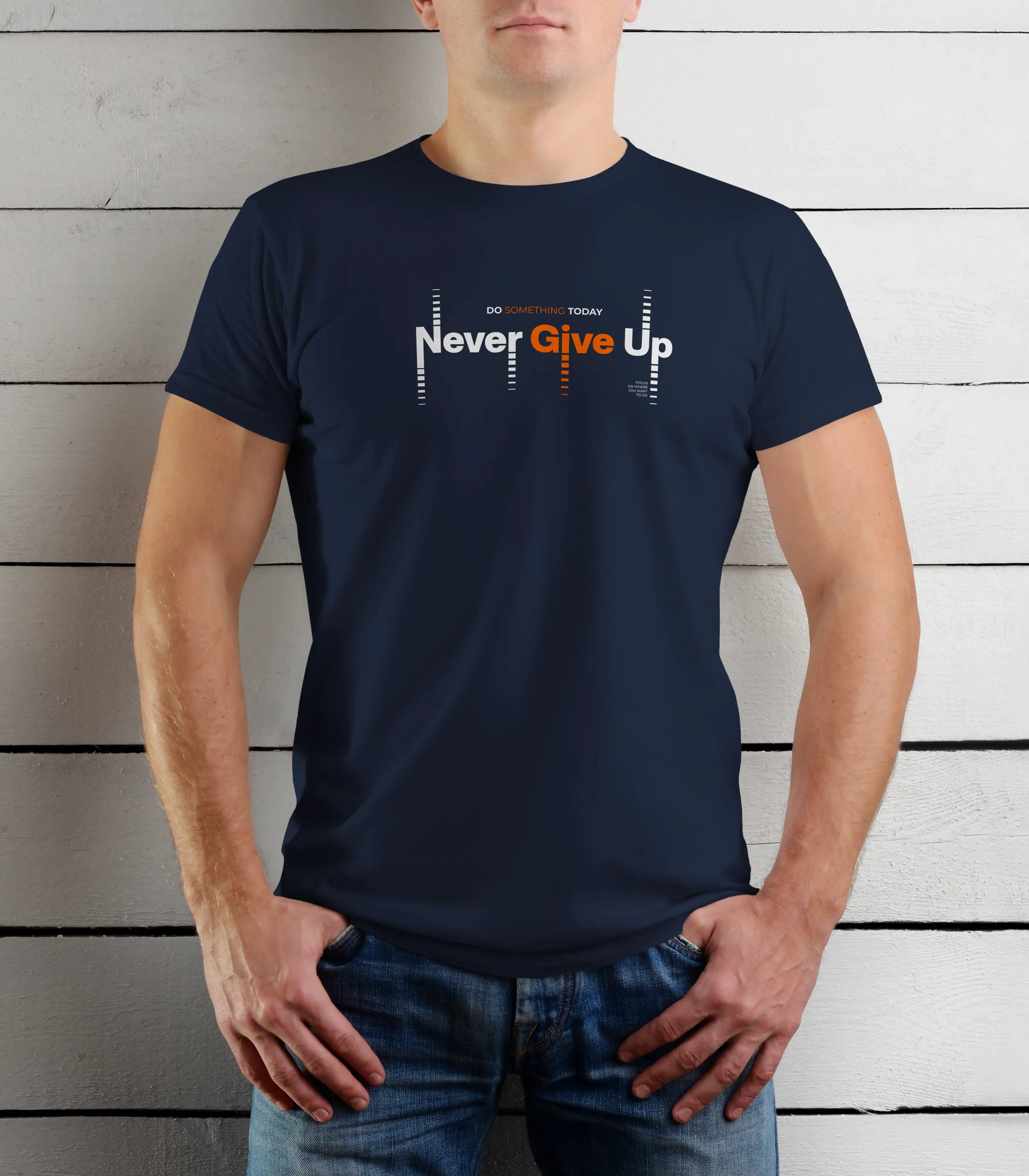 Person wearing a navy blue t-shirt with 'Never Give Up' text against a wooden background