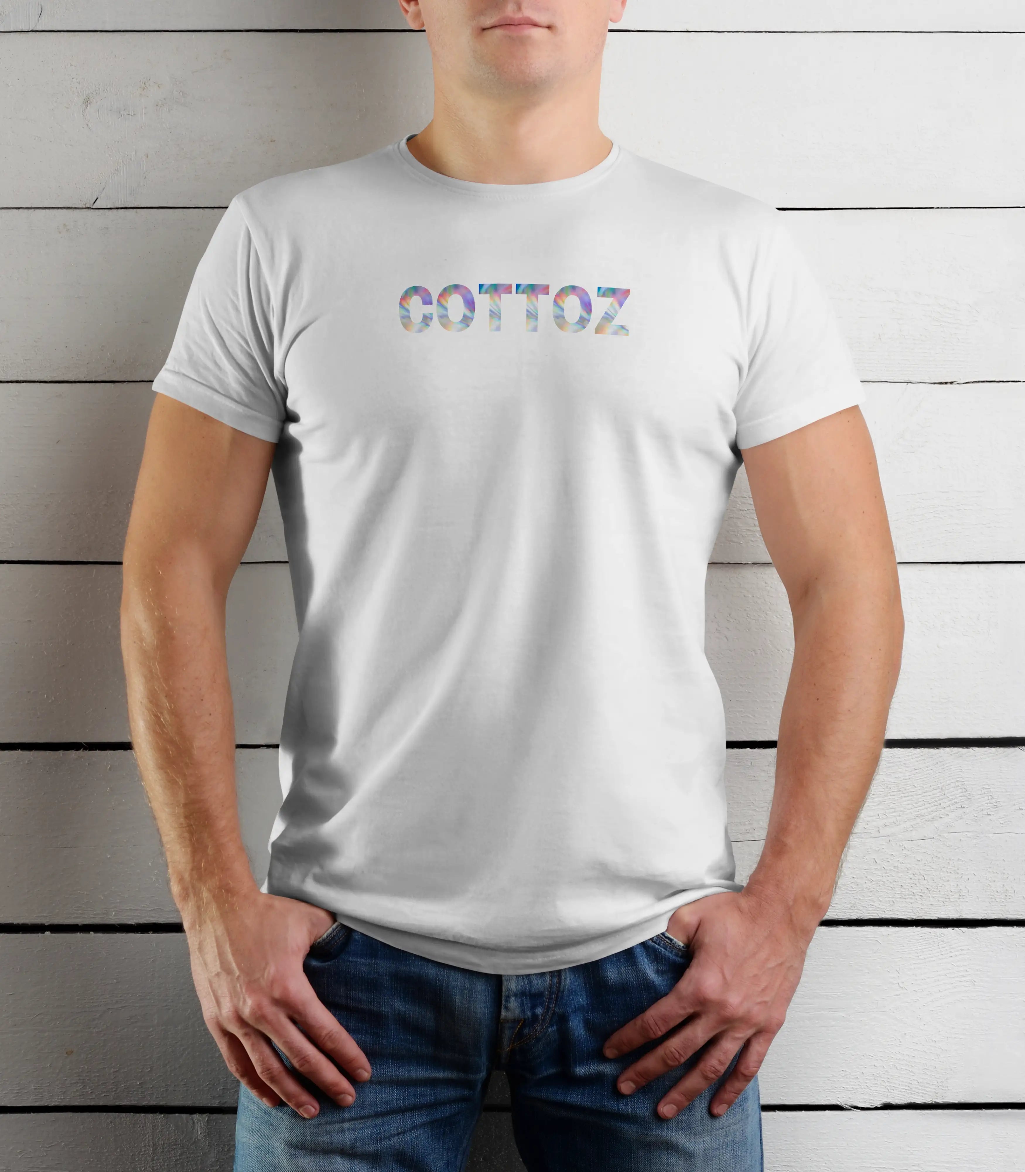 Person wearing a white t-shirt with 'GOTTOZ' printed on it against a wooden background