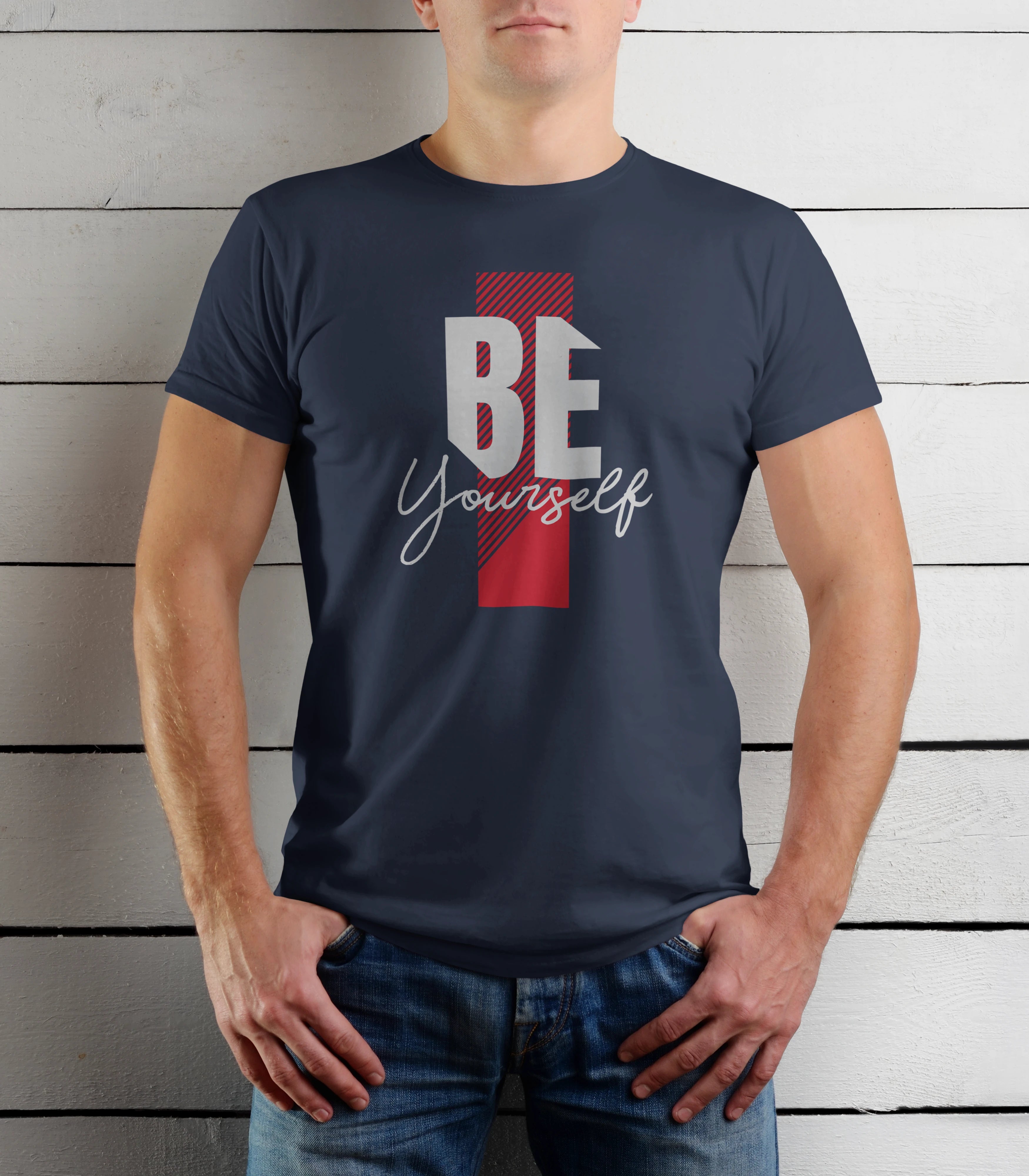Person wearing a navy blue t-shirt with 'BE Yourself' text against a wooden background