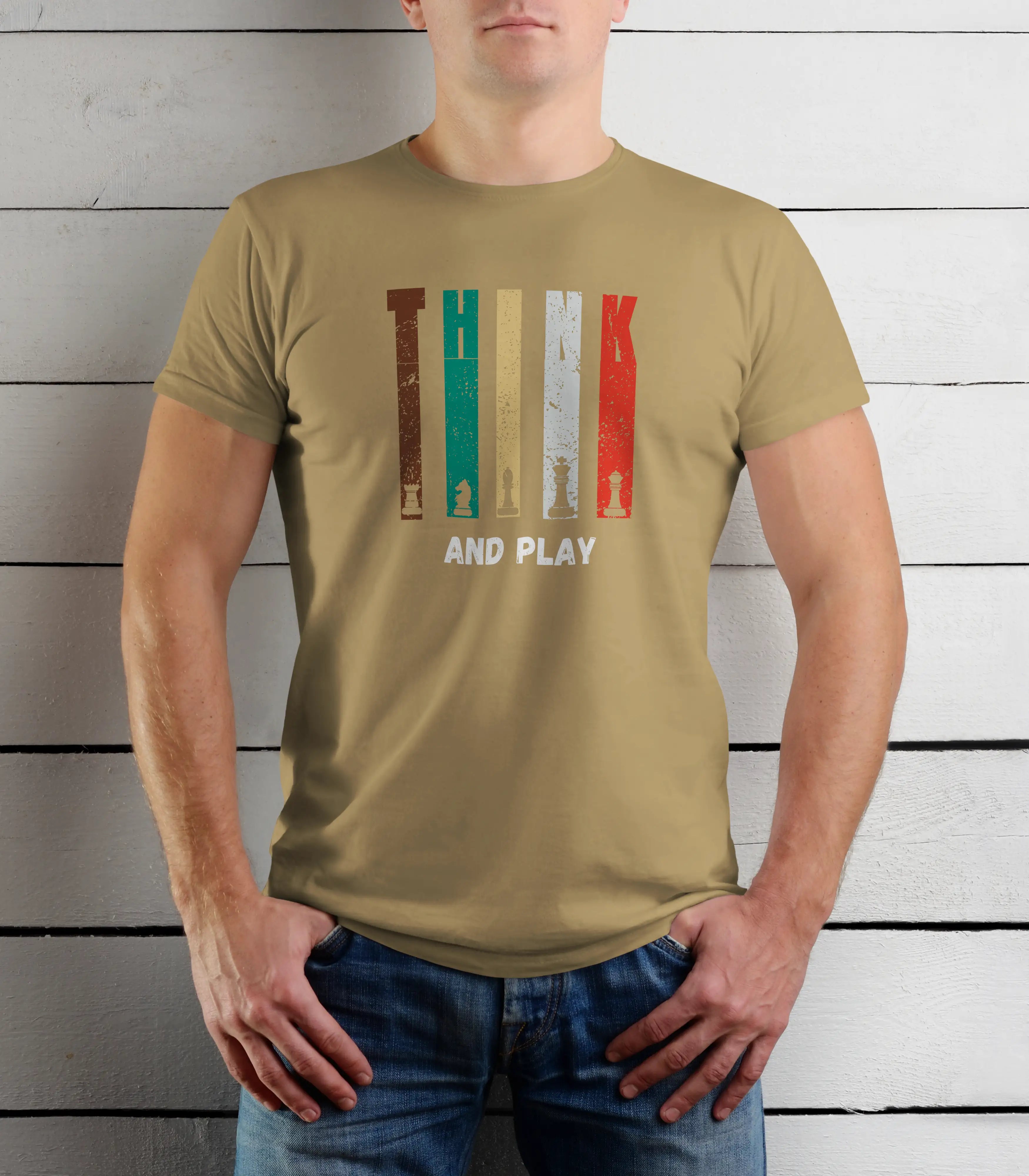 Person wearing a beige t-shirt with a graphic design and text against a wooden background
