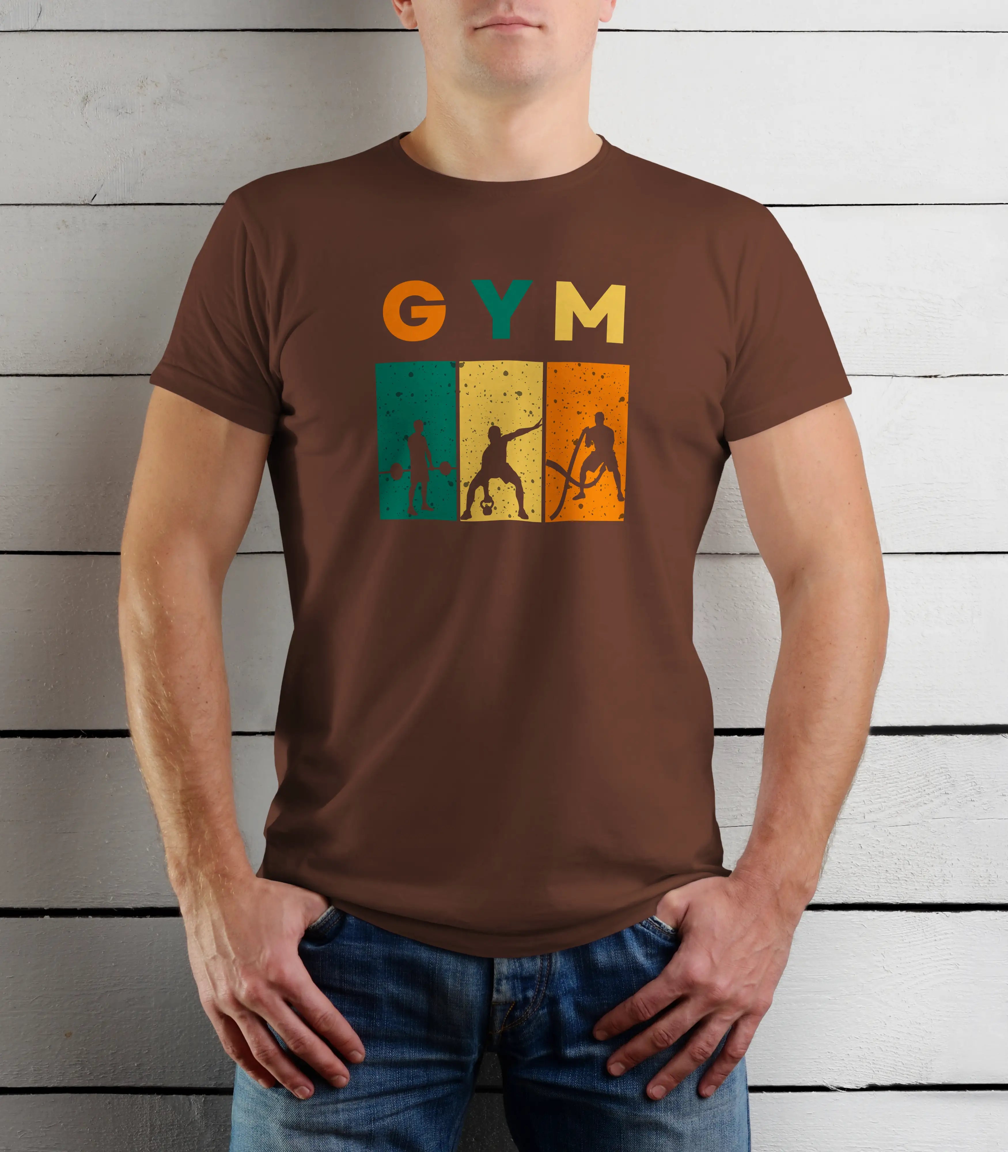 Person wearing a brown t-shirt with 'GYM' and gym-themed graphics against a wooden background