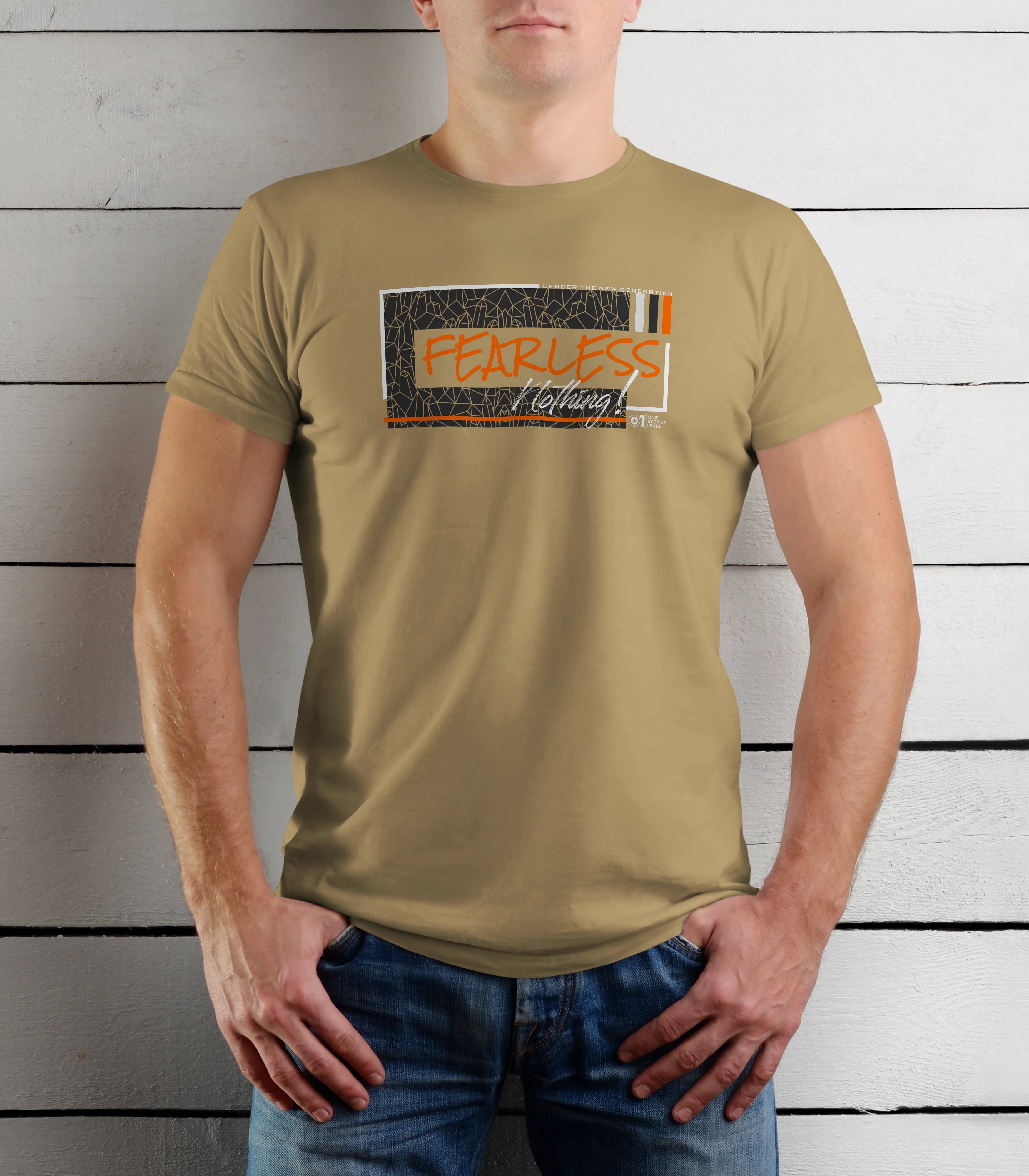 Person wearing a beige t-shirt with a graphic design on a wooden background