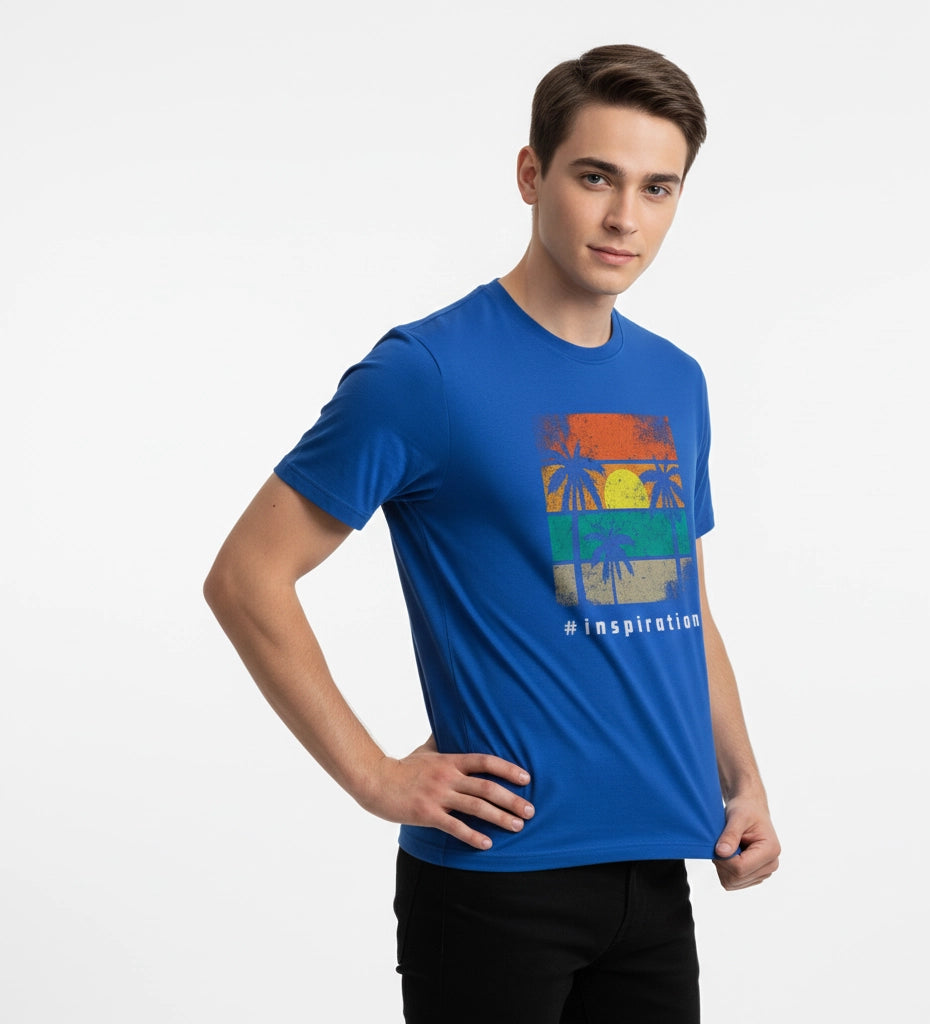 Man wearing a blue t-shirt with a colorful graphic design on a white background