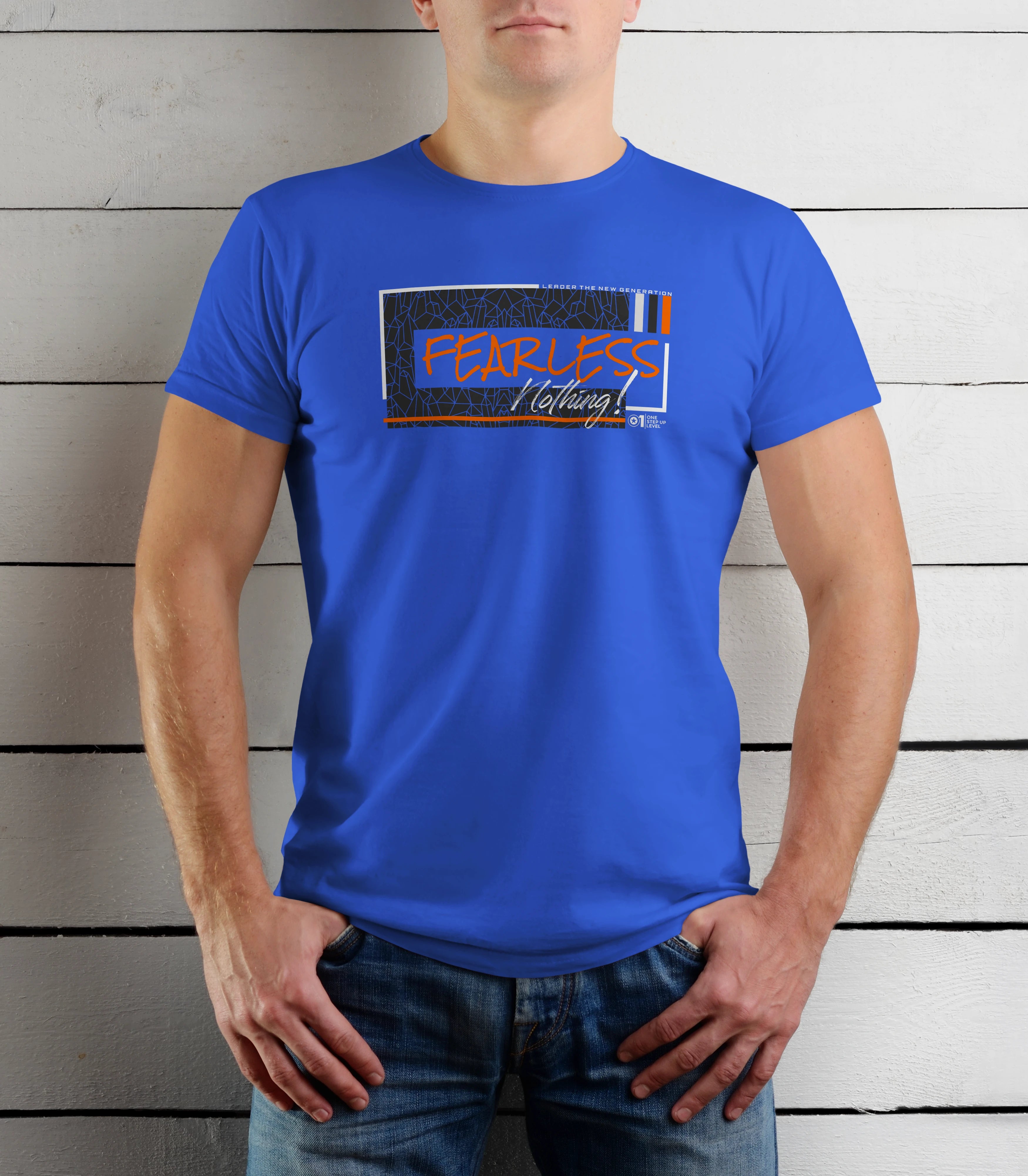 Person wearing a blue t-shirt with a graphic design on a wooden background
